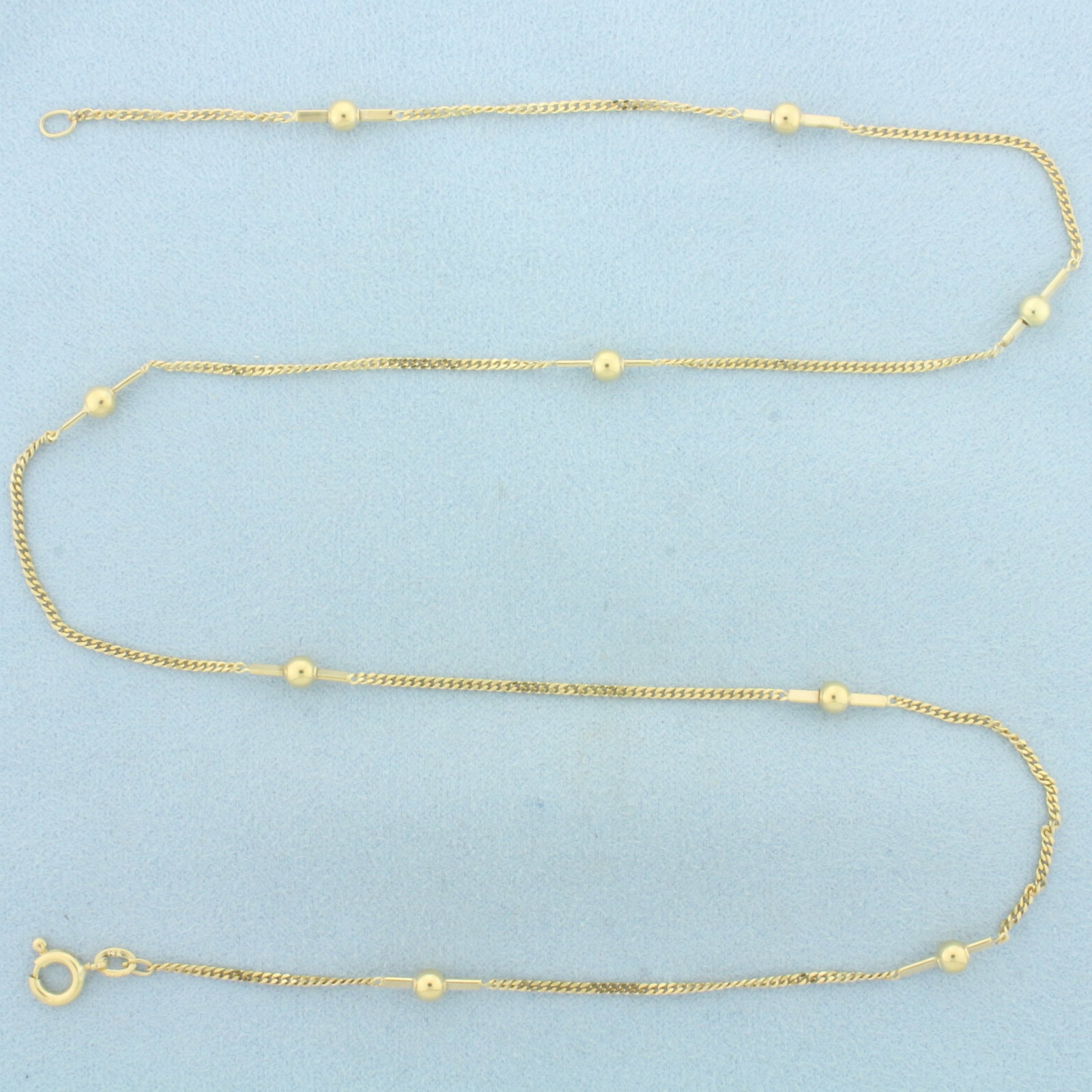 21 Inch Ball Bead Link Bar Necklace in 14k Yellow Gold: In 14k Yellow Gold. 21 inches long. 1.5mm wide chain. 4mm wide gold ball beads. Italian made. Spring clasp. 5.2g.