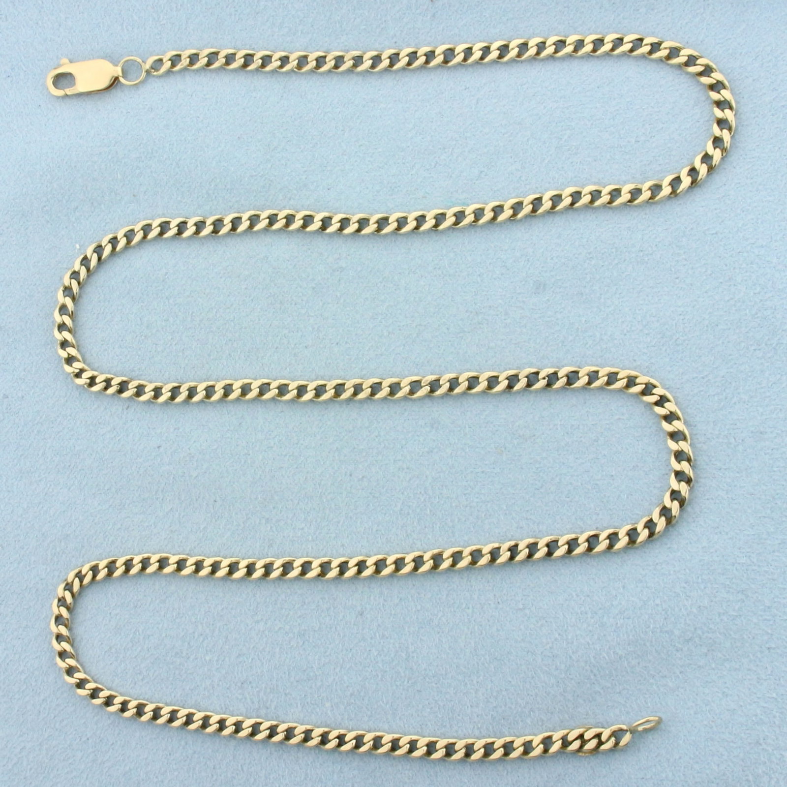 23 Inch Curb Link Chain Necklace in 14k Yellow Gold: In 14k Yellow Gold. 23 inches long. 3.5mm wide. Lobster clasp. 21.1g.