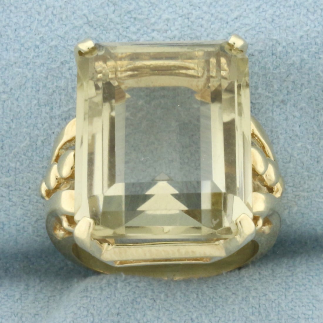 Citrine Solitaire Statement Ring in 14k Yellow Gold: In 14k Yellow Gold. Contains one 20x15mm high quality emerald cut natural Citrine gemstone, approximately 16cts, with bright color and excellent clarity. Size 6. 12.0g.