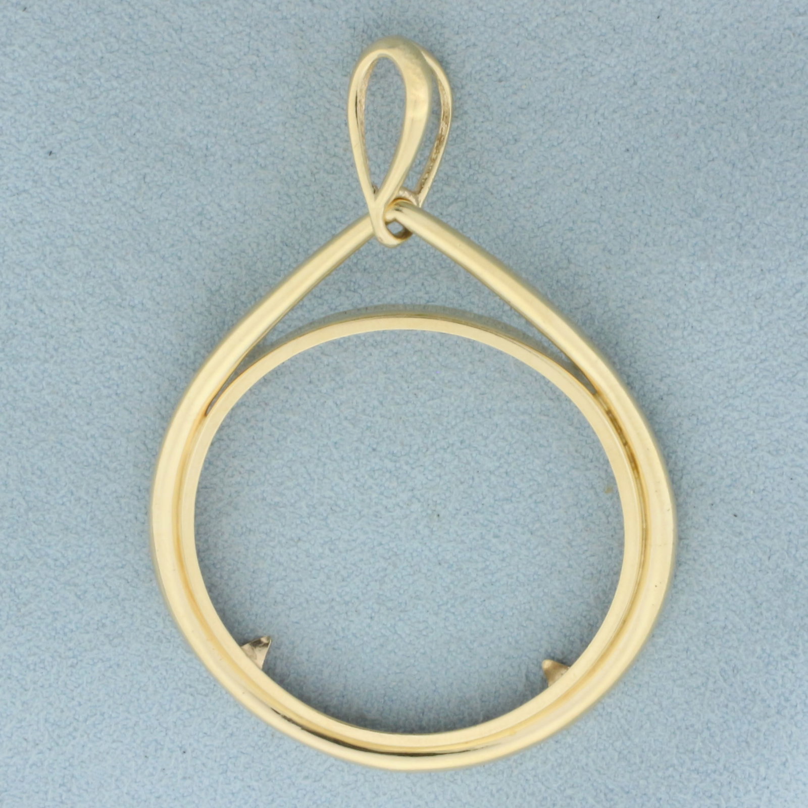 34mm $20 Gold Coin Bezel Pendant in 14k Yellow Gold: In 14k Yellow Gold. Bezel for US $20 Double Eagle Gold Coin. 2 1/4 inch long including bale. 1 1/2 inch wide. 6.4g.
