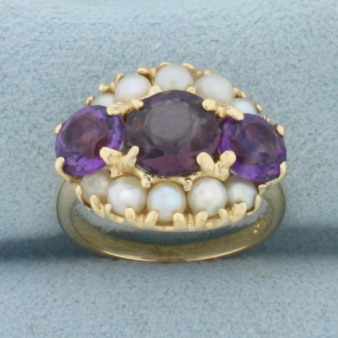 Vintage Amethyst and Seed Pearl Ring in 14k Yellow Gold: In 14k Yellow Gold. Contains one 7mm and two 5.7mm high quality natural Amethyst gemstones with intense color and excellent clarity. Also contains six 3mm and four 2mm high quality natural Seed Pearls