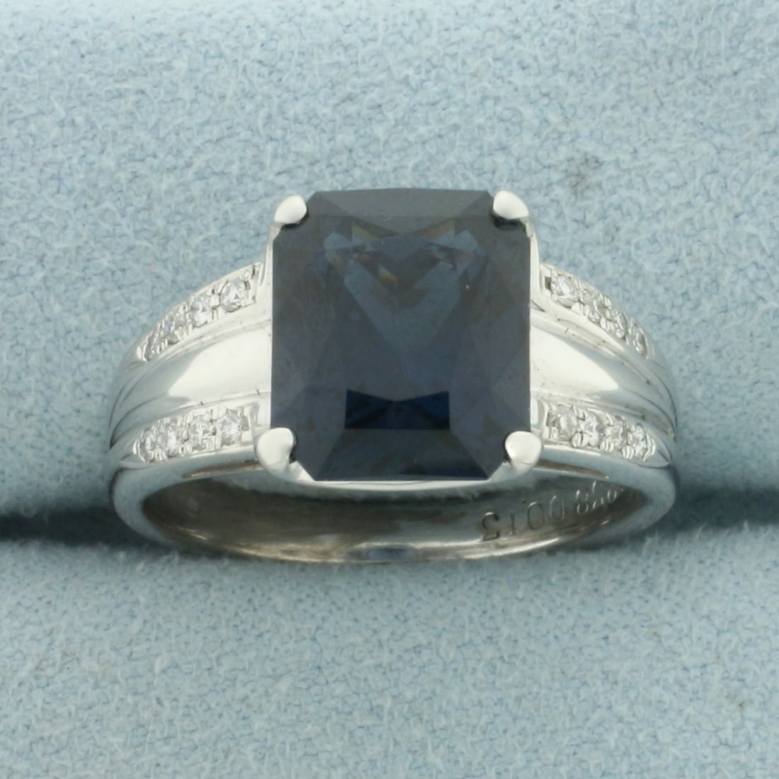 Cushion Cut Natural Spinel and Diamond Ring in 18k White Gold: In 18k White Gold. Contains one high quality natural 10.6mm by 9mm Cushion cut Blue Spinel gemstone, 5.238ct, with intense color and excellent clarity. Also contains sixteen high quality diamonds,