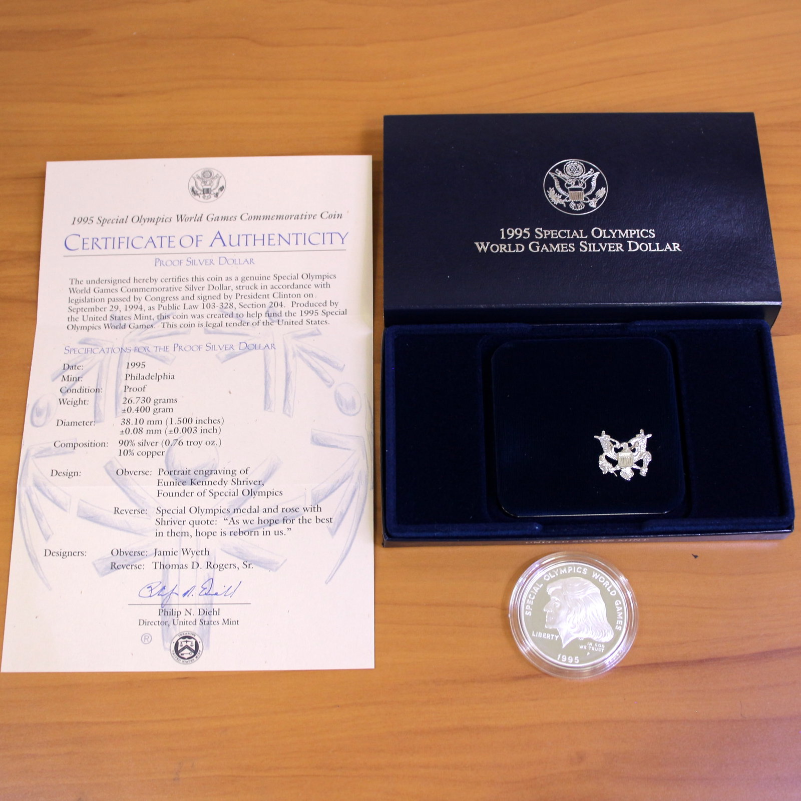 US Mint Special Olympics World Games Silver Dollar Proof Coin OGP: Contains one 1995 90% Silver Commemorative Silver Dollar. Set in original packaging and contains certificate of authenticity.