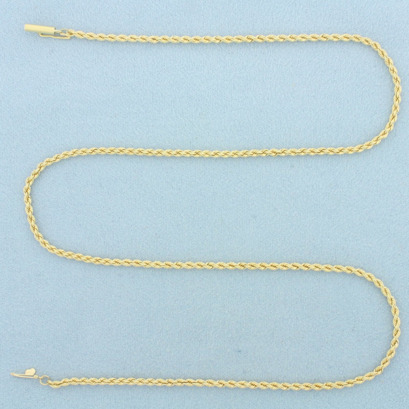 18 Inch Rope Link Chain Necklace in 18k Yellow Gold: In 18k Yellow Gold. 18 inches long. 2.1mm wide. Barrel clasp with safety latch. 8.9g.