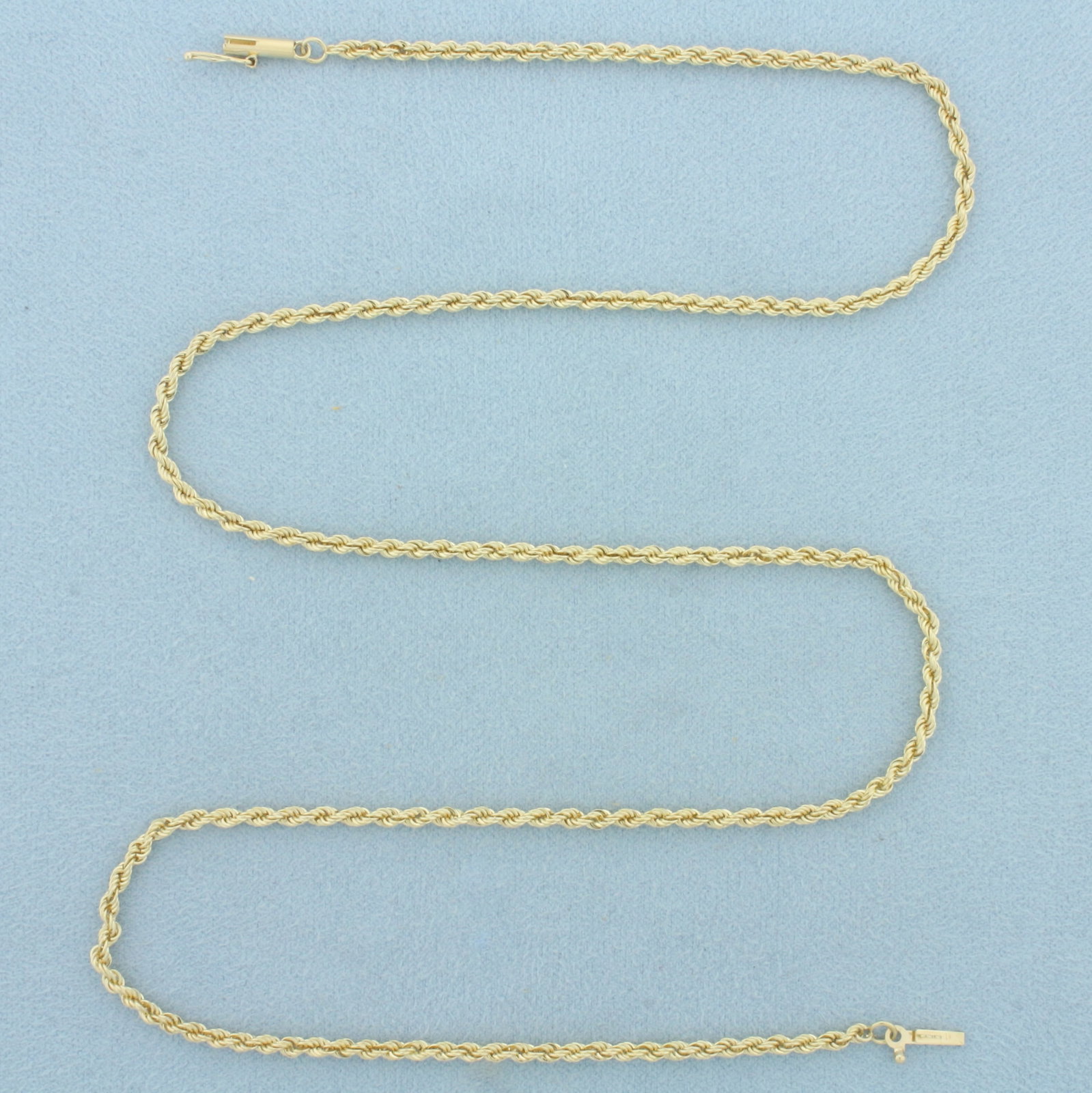 20 Inch Rope Link Chain Necklace in 14k Yellow Gold: In 14k Yellow Gold. 20 inches long. 2.2mm wide. Barrel clasp with safety latch. 8.8g.
