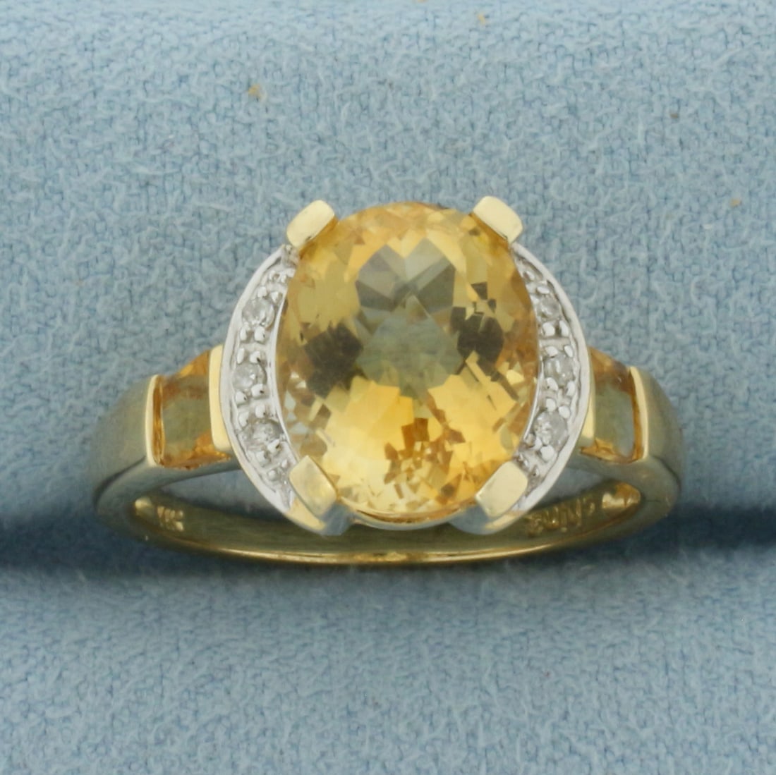 Citrine and Diamond Ring in 14K Yellow Gold: In 14k yellow gold. Contains 1 fancy checkerboard oval cut natural high quality Citrine gemstone, 11x9mm, approximately 3.25ct, bright color and excellent clarity. Also contains two 3.2mm square cut C