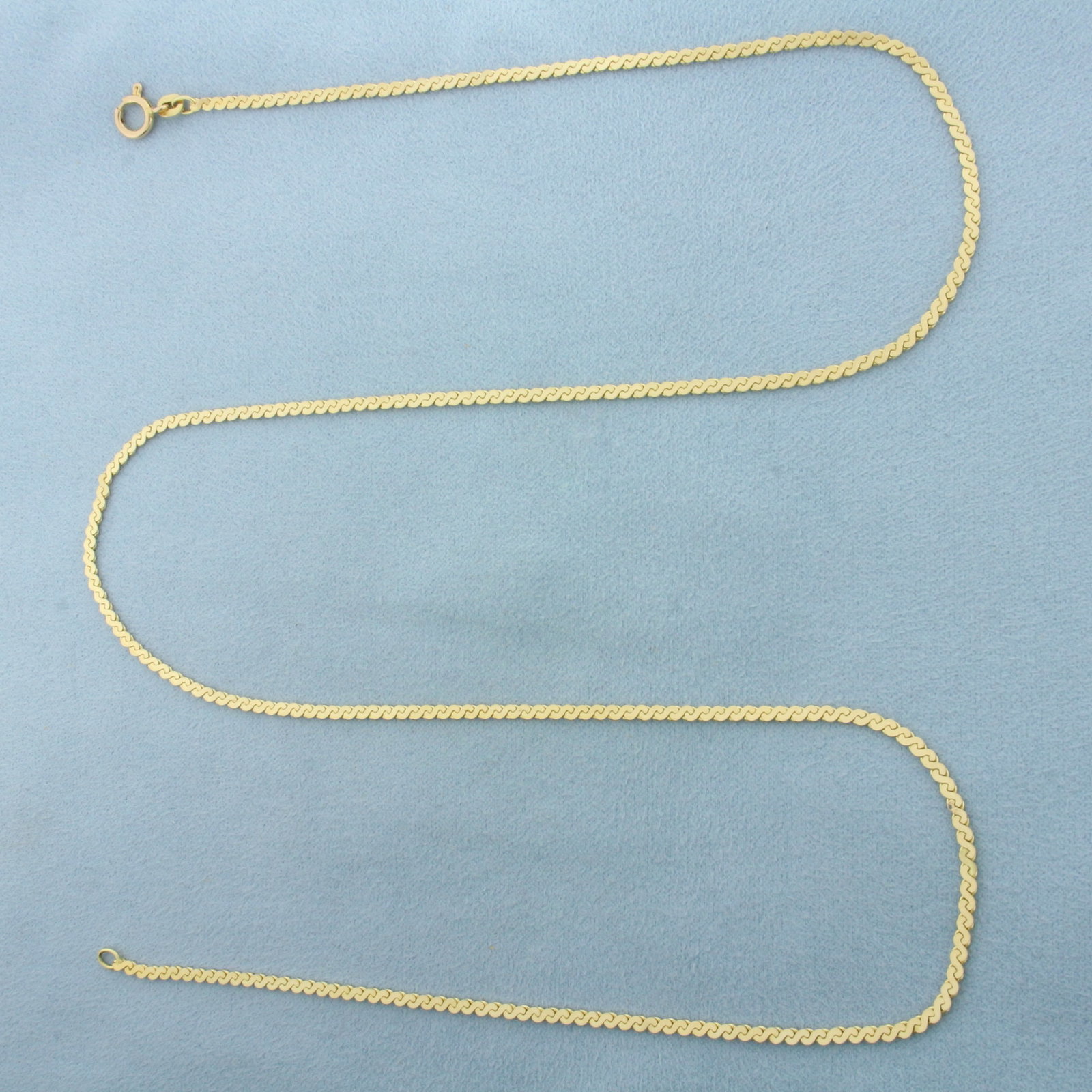 24 Inch Serpentine S-Link Chain Necklace in 14k Yellow Gold: In 14k Yellow Gold. 24 inches long. 2.2mm wide. Italian made. Spring clasp. 8.8g.
