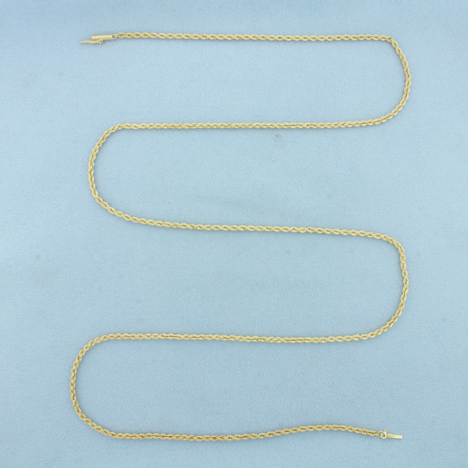 30 Inch Rope Link Chain Necklace in 14k Yellow Gold: In 14k Yellow Gold. 30 inches long. 2.4mm wide. Barrel clasp with safety latch. 15.1g.