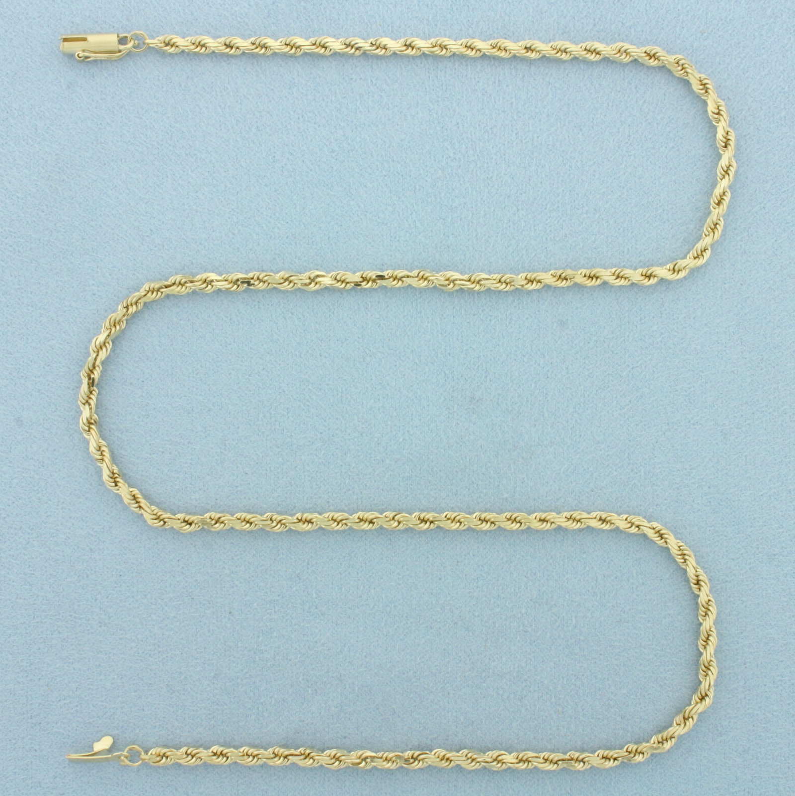18 Inch Rope Link Chain Necklace in 14k Yellow Gold: In 14k Yellow Gold. 18 inches long. 3.1mm wide. Barrel clasp with safety latch. 12.6g.