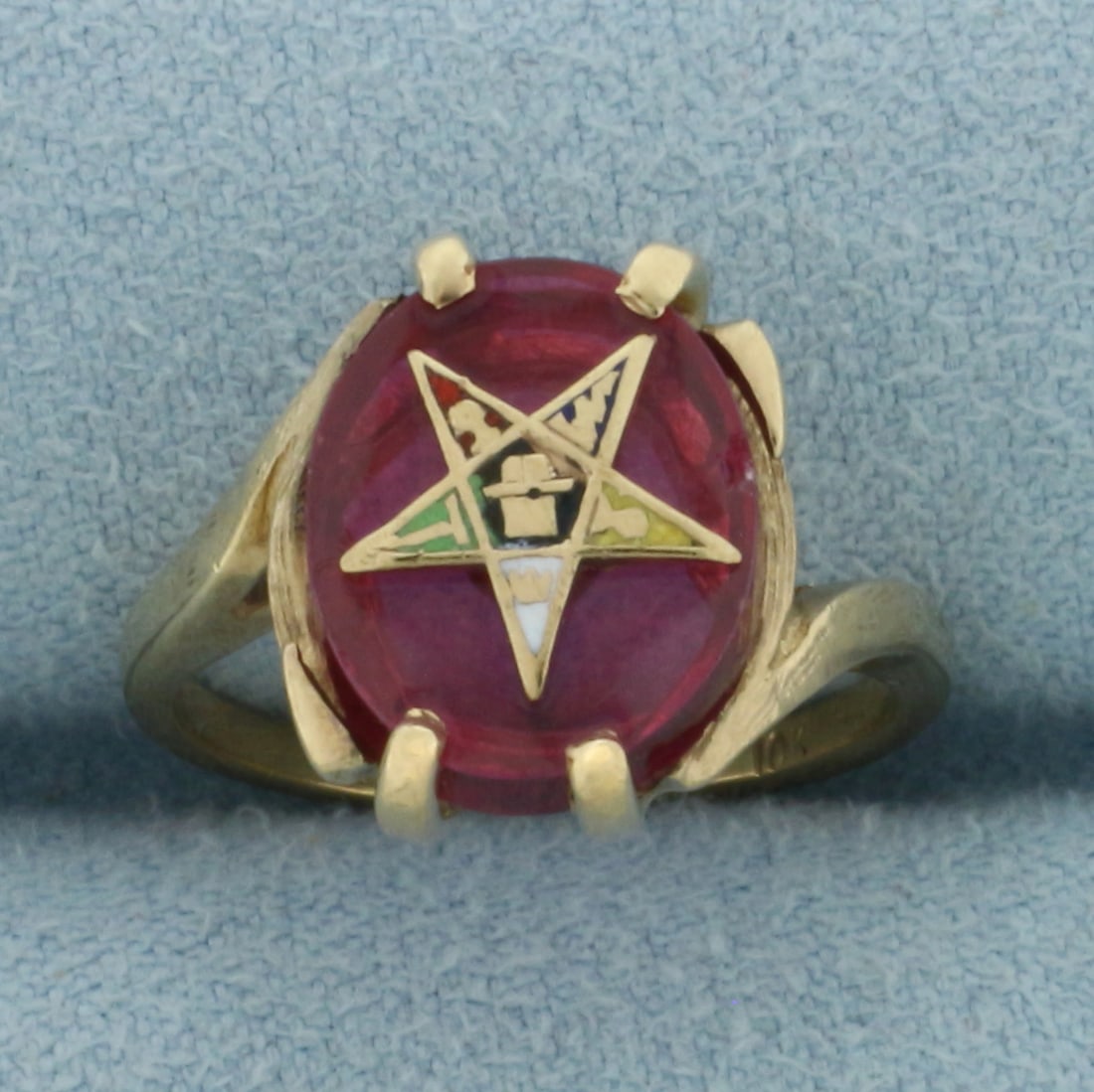 Vintage Eastern Star Masonic Ring in 10k Yellow Gold: In 10k Yellow Gold. Contains one 12x10mm high quality oval Synthetic Ruby gemstone with small chip, indicative of age. Size 5. 3.5g.