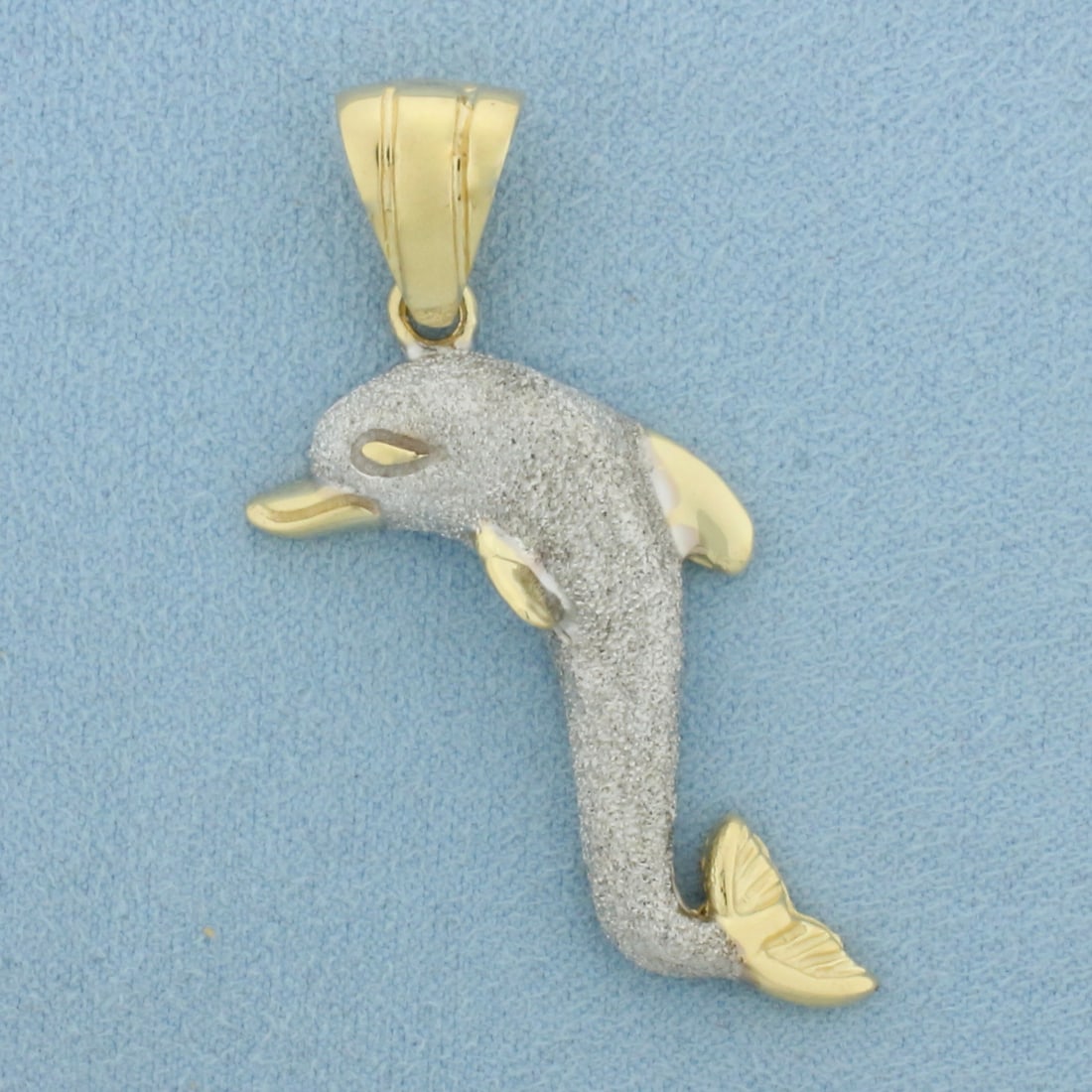 Dolphin Pendant Sandblast Finish in 14k Yellow and White Gold: In 14k Yellow and White Gold. 2 inch long. 1 inch wide (at widest point). 11.7g.
