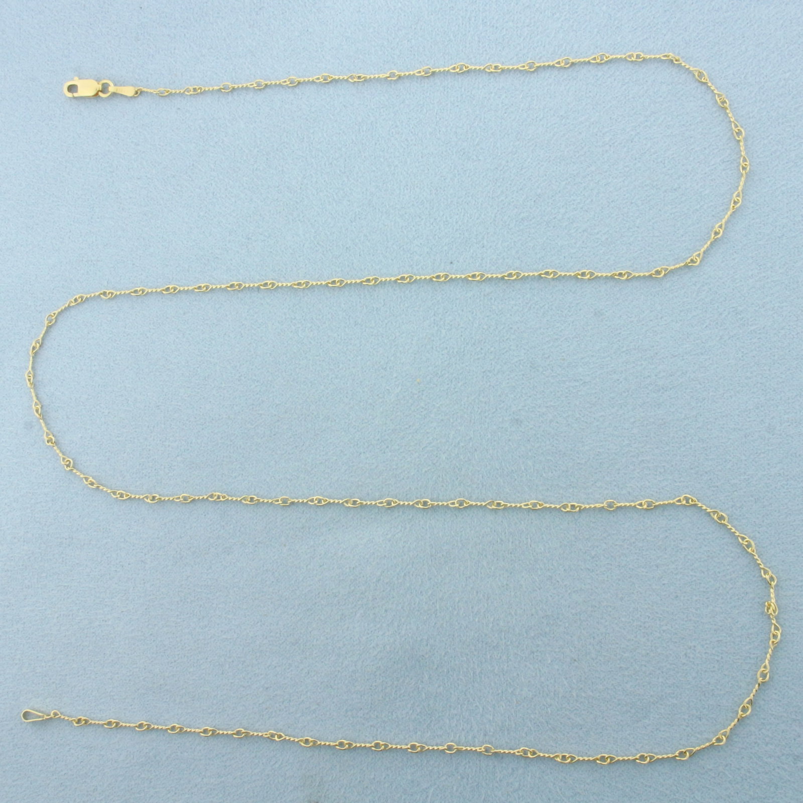 24 Inch Italian Twisting Link Chain Necklace in 14k Yellow Gold: In 14k Yellow Gold. 24 inches long. 1.9mm wide. Italian made. Lobster clasp. 3.2g.