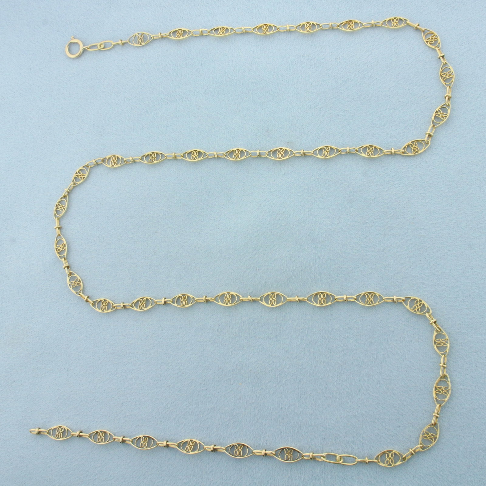 24 Inch Butterfly Filigree Link Chain Necklace in 14k Yellow Gold: In 14k Yellow Gold. 24 inches long. 4.8mm wide. Spring clasp. 9.7g.