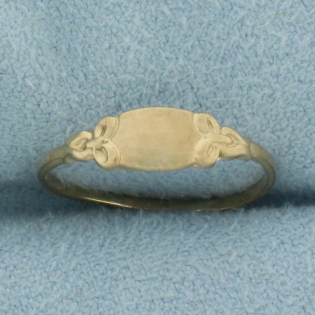 Vintage Child or Pinky Signet Ring in 10k Yellow Gold: In 10k Yellow Gold. 4.5mm wide at top of ring. Engravable. Size 4. .6g.