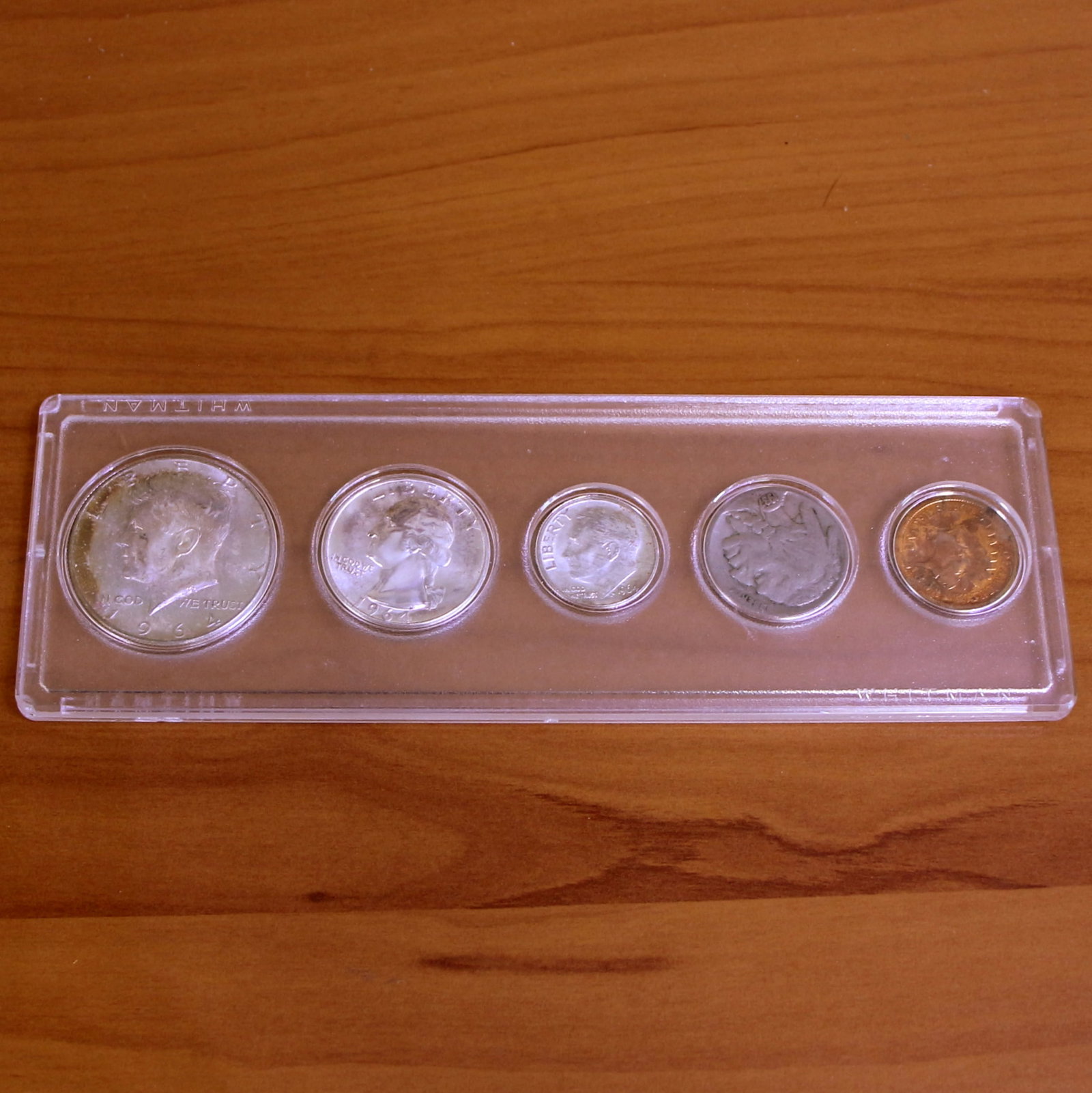 1964 Uncirculated Coin Set: Includes 90% silver: Half dollar, quarter, dime. Also includes a 1937 Buffalo Nickel and 1893 Indian Head Cent.
