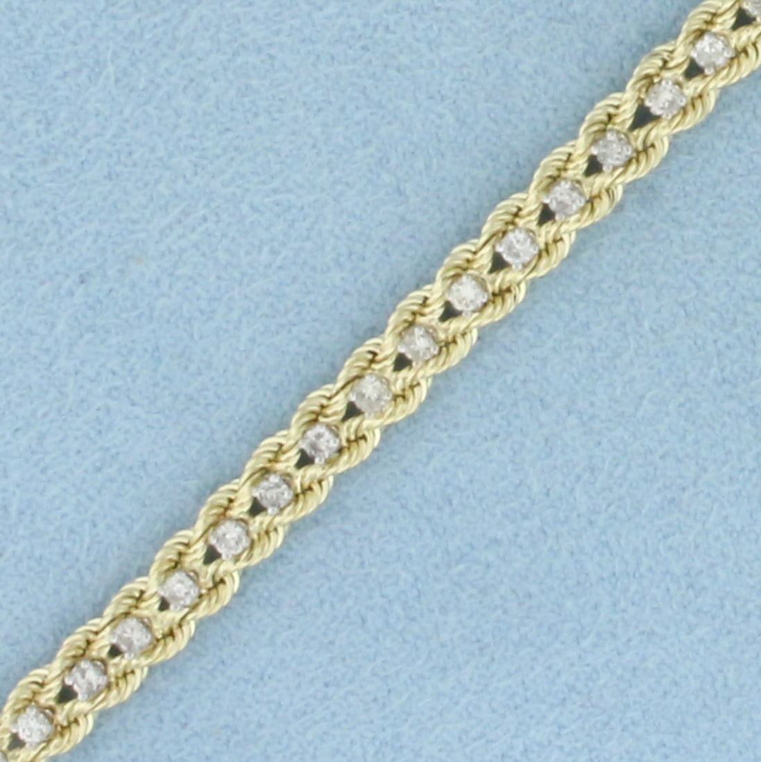 Diamond Double Rope Tennis Bracelet in 14k Yellow Gold: In 14k Yellow gold. 7 inches long. 4.5mm wide. Contains 50 high quality diamonds, 1 carat total weight, I color/I clarity. Concealed slide clasp with safety latch. 8.3g.