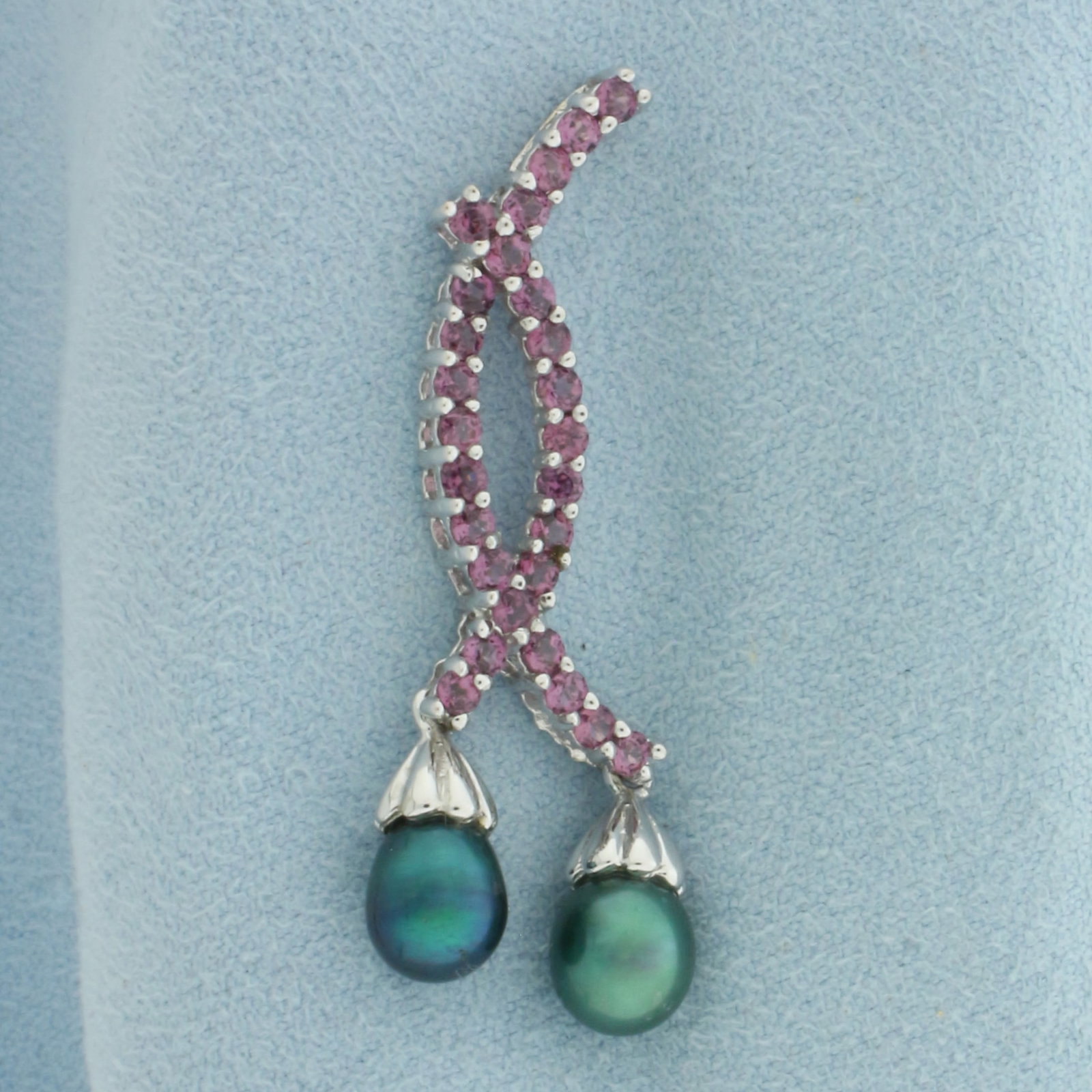 Morganite and Pearl Pendant in 10k White Gold: In 10k White Gold. Contains twenty-seven 2mm high quality Morganite gemstones, approximately 1.ct TW, with intense salmon color and excellent clarity. Also contains two 8x6mm high quality Pearls with 