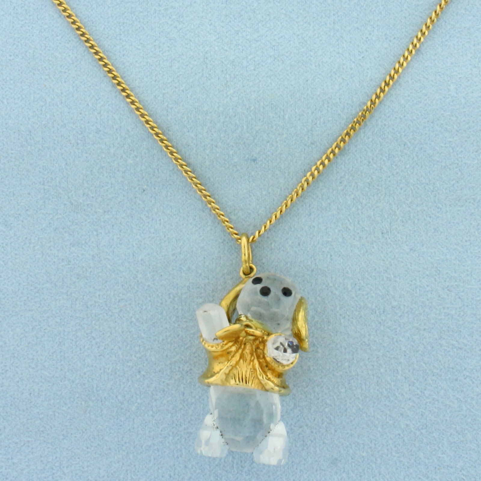 Swarovski Crystal Dog Necklace: Gold Plated. Dog pendant is 1 3/8 inch long (including bale) by 3/4 inch wide. 20.75 inches long chain. Includes box and certificate. Lobster clasp.