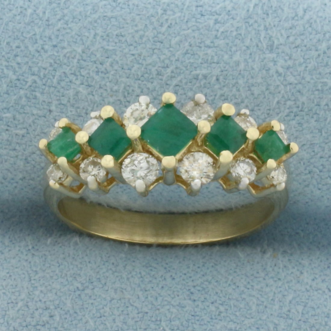 Emerald and Diamond Ring in 14k Yellow Gold: In 14k Yellow Gold. Contains one 3.5mm, two 2.6mm, and two 2.3mm high quality step square cut natural Emerald gemstones with intense color. Also contains12 high quality diamonds, 1/2ct TW, SI clarity/
