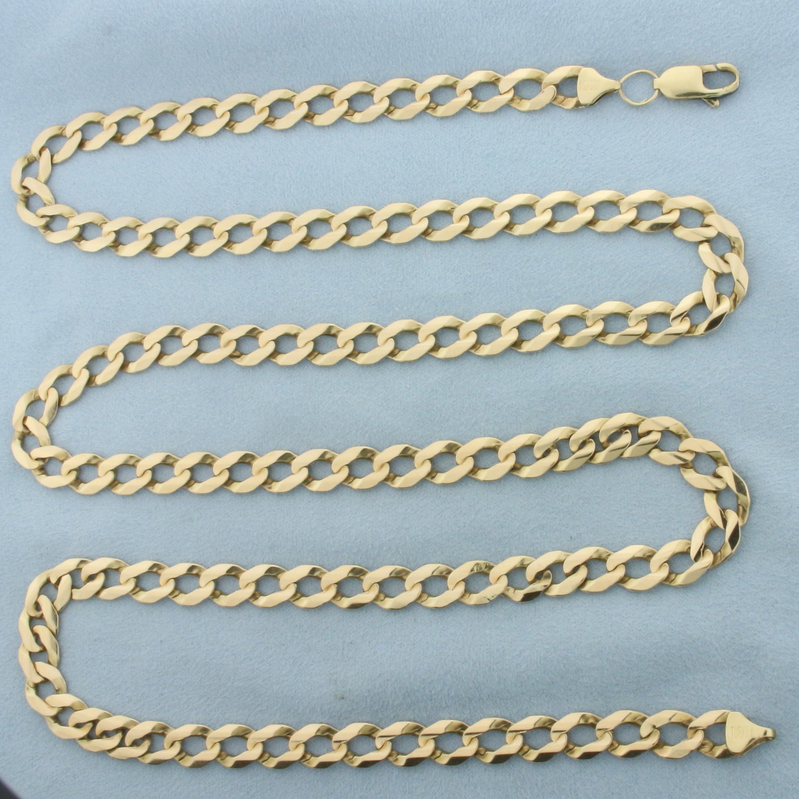Long 37 Inch Curb Link Chain Necklace in 10k Yellow Gold: In 10k Yellow Gold. 37 inches long. 8.2mm wide. Lobster clasp. 61.1g.