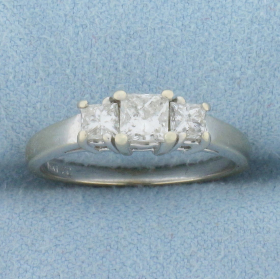 Three Stone Princess Diamond Engagement or Anniversary Ring in 14k White Gold: 14K white gold. Contains one 1/3ct and two .15ct high quality princess cut diamonds, H color/I clarity. Diamonds are very "white" and are completely eye clean with great cut for added brilliance. Size