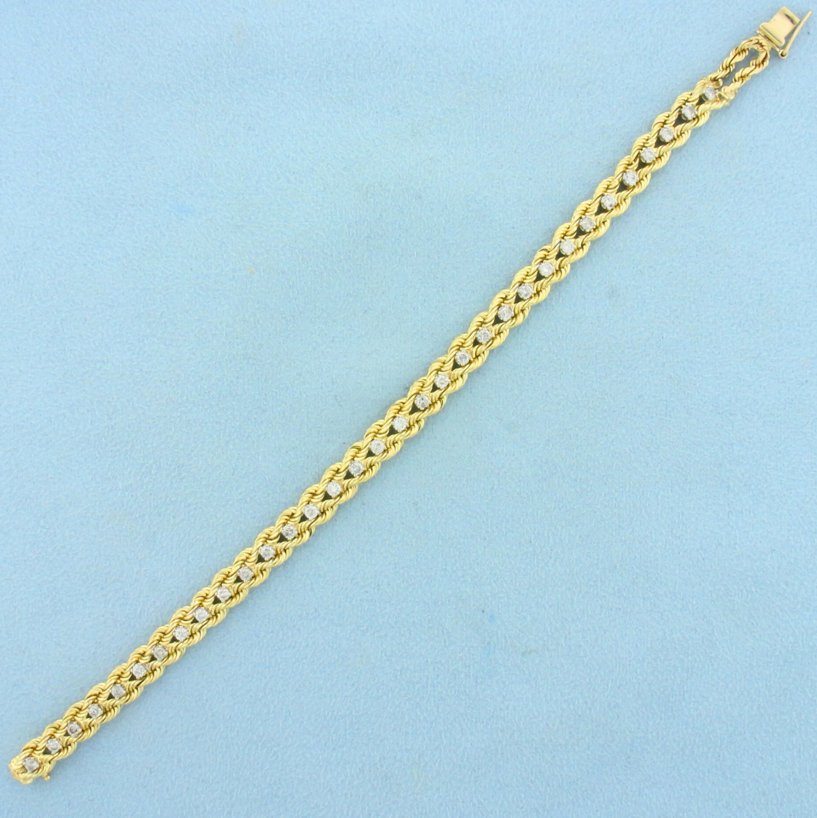 Diamond Rope Link Tennis Bracelet in 14K Yellow Gold: In 14K Yellow Gold. Contains thirty two high quality Diamonds, 1.5ct TW, H color/I clarity. With safety clasp. 7 1/2 Inches long. 6.7mm wide. 17.3g