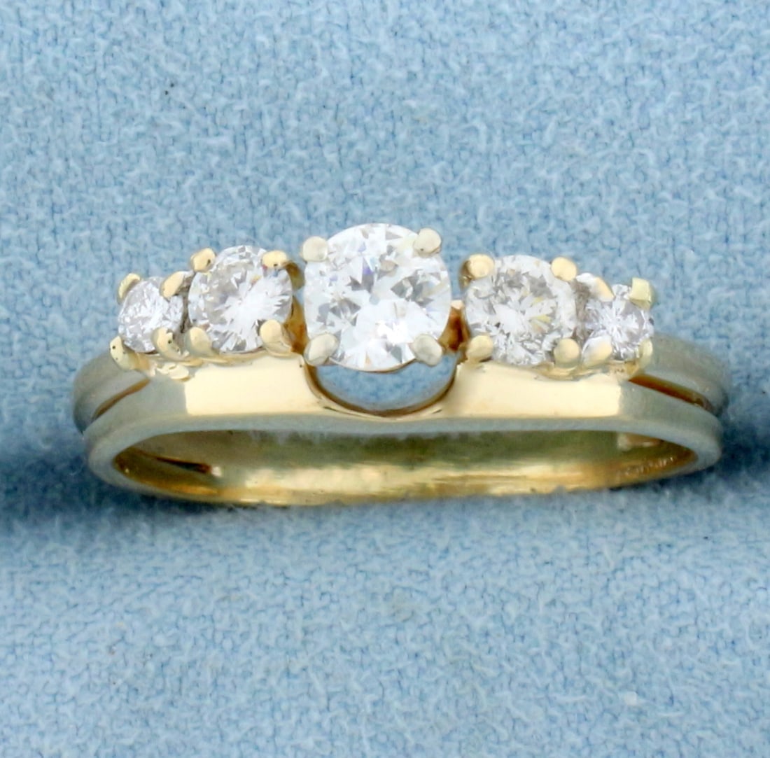 Vintage Five Stone Diamond Wedding or Anniversary Ring in 14K Yellow Gold: In 14K Yellow Gold. Contains one 1/3ct Old European Cut, two .15ct round brilliant and two .06ct round brilliant high quality diamonds, SI clarity/H color, eye clean. 3/4ct TW. Note center diamond has