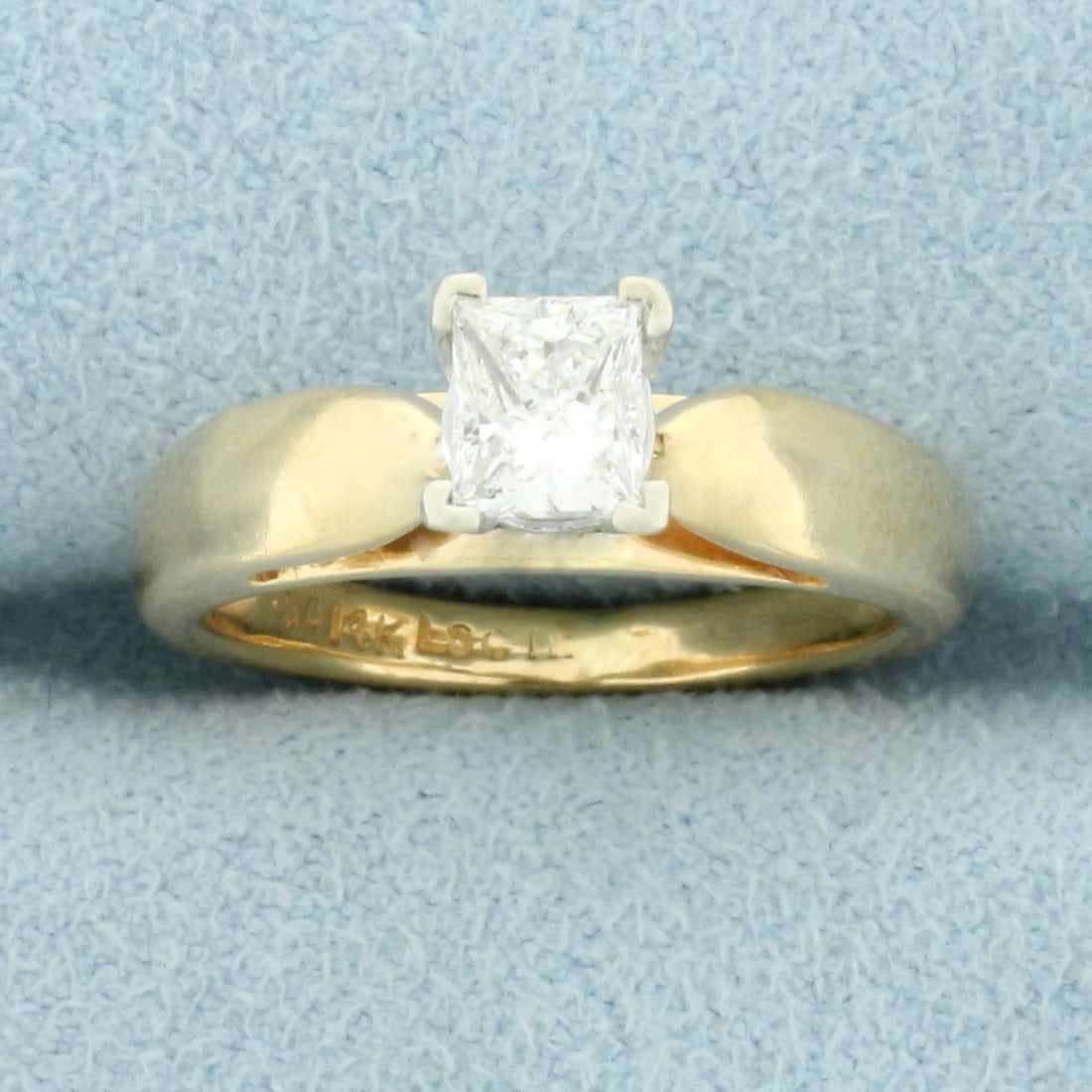 Solitaire Princess Diamond Engagement Ring in 14K Yellow Gold: In 14K Yellow Gold. Contains one high quality 1/2ct Princess cut Diamond, F color/SI1 clarity, completely eye clean and great cut for extra sparkle. Size 3 1/2. 3.7g.