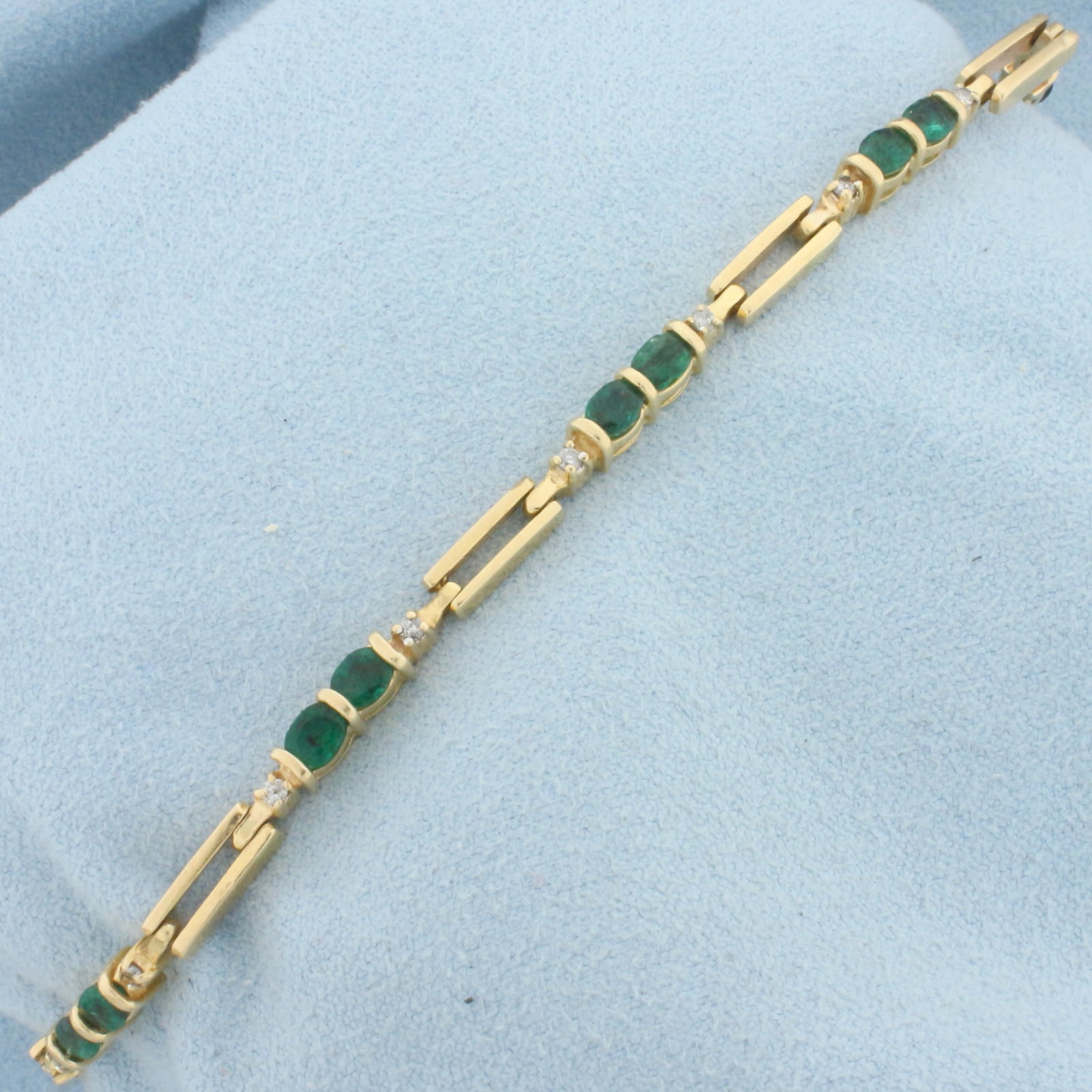 Emerald and Diamond Bracelet in 14k Yellow Gold: In 14k Yellow Gold. Contains 12 high quality natural oval cut 1/4ct emerald gemstones with intense green color. Accented by twelve .01ct high quality diamonds, I color/I clarity. 7 inches long, 3.5mm 