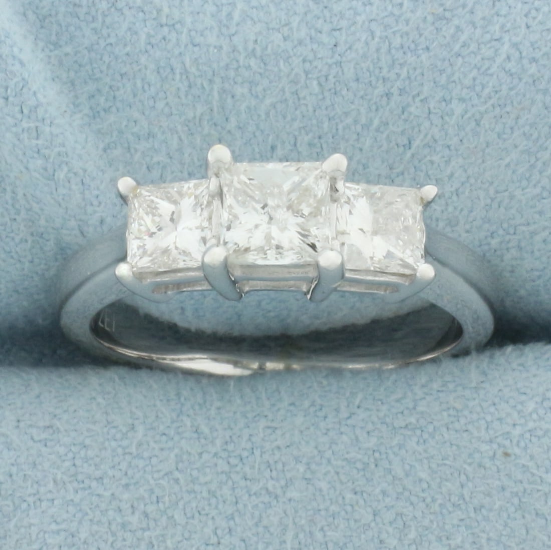 Princess Cut 3 Stone Engagement or Anniversary Ring in 14k White Gold: In 14k white gold. Contains one .6ct and two .45ct high quality princess cut diamonds, I color/I clarity, great cut for lots of sparkle and eye clean. Size: 7. 4.5g.