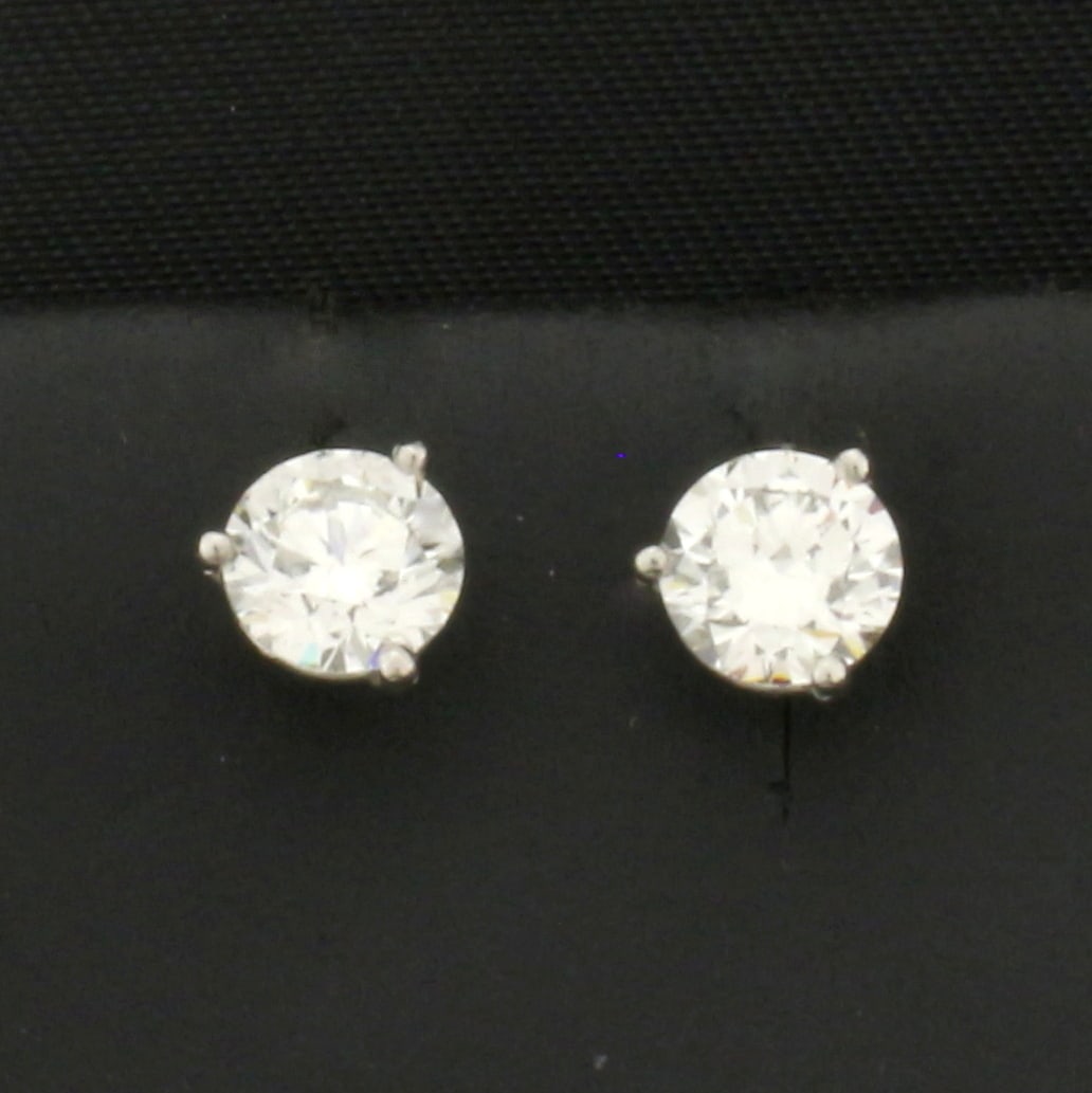 1ct Natural Diamond Stud Earrings in Platinum Settings: In platinum martini settings. Contains two 1/2ct natural round brilliant diamonds. Excellent cut, polish, and symetry for extremely high brilliance. H color, SI clarity, eye clean, diamonds face up ve