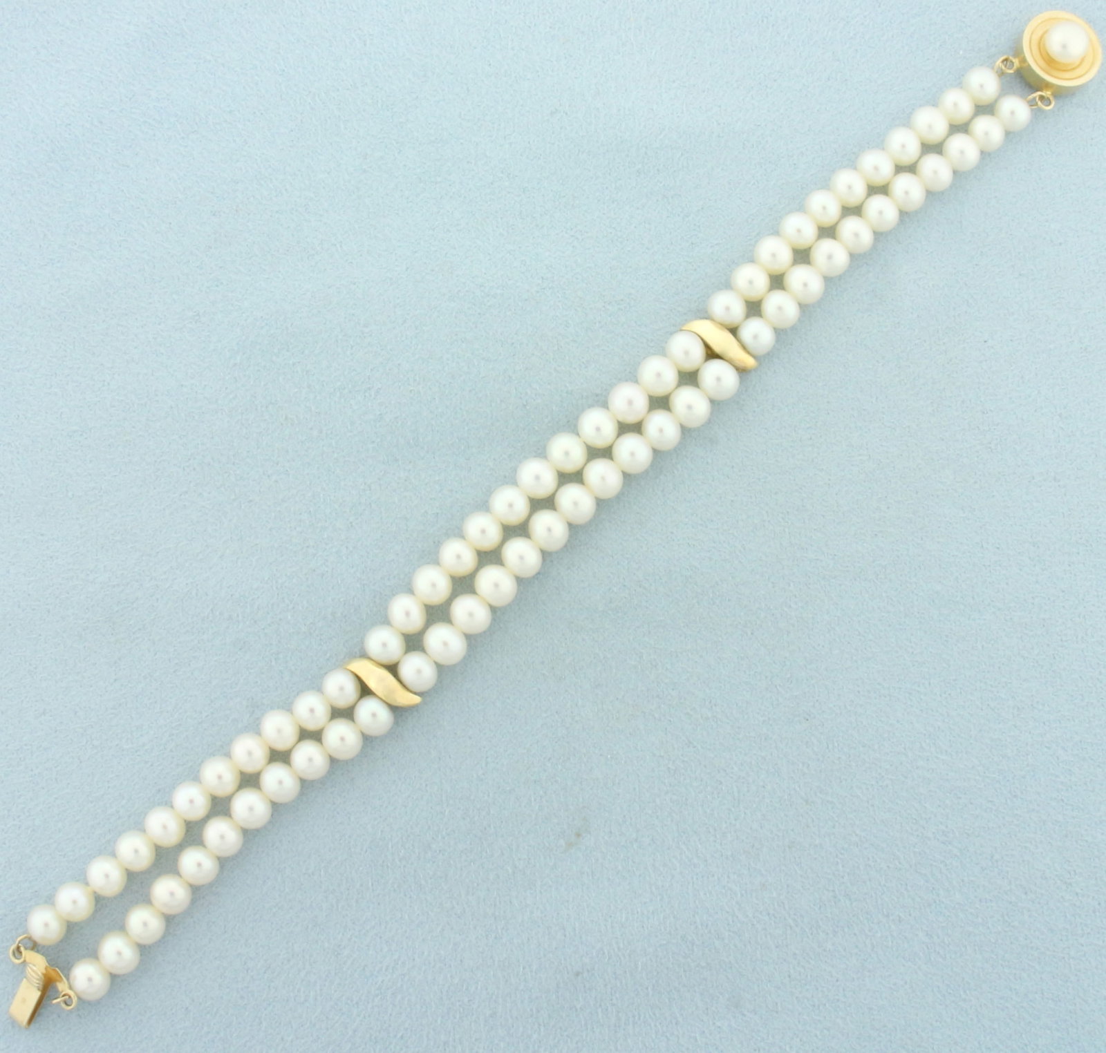 Double Pearl Strand Bracelet in 14k Yellow Gold: In 14k yellow gold. Contains 67 high quality 5.2mm cultured pearls with high luster. 7 1/4 inches long. 14.3g.