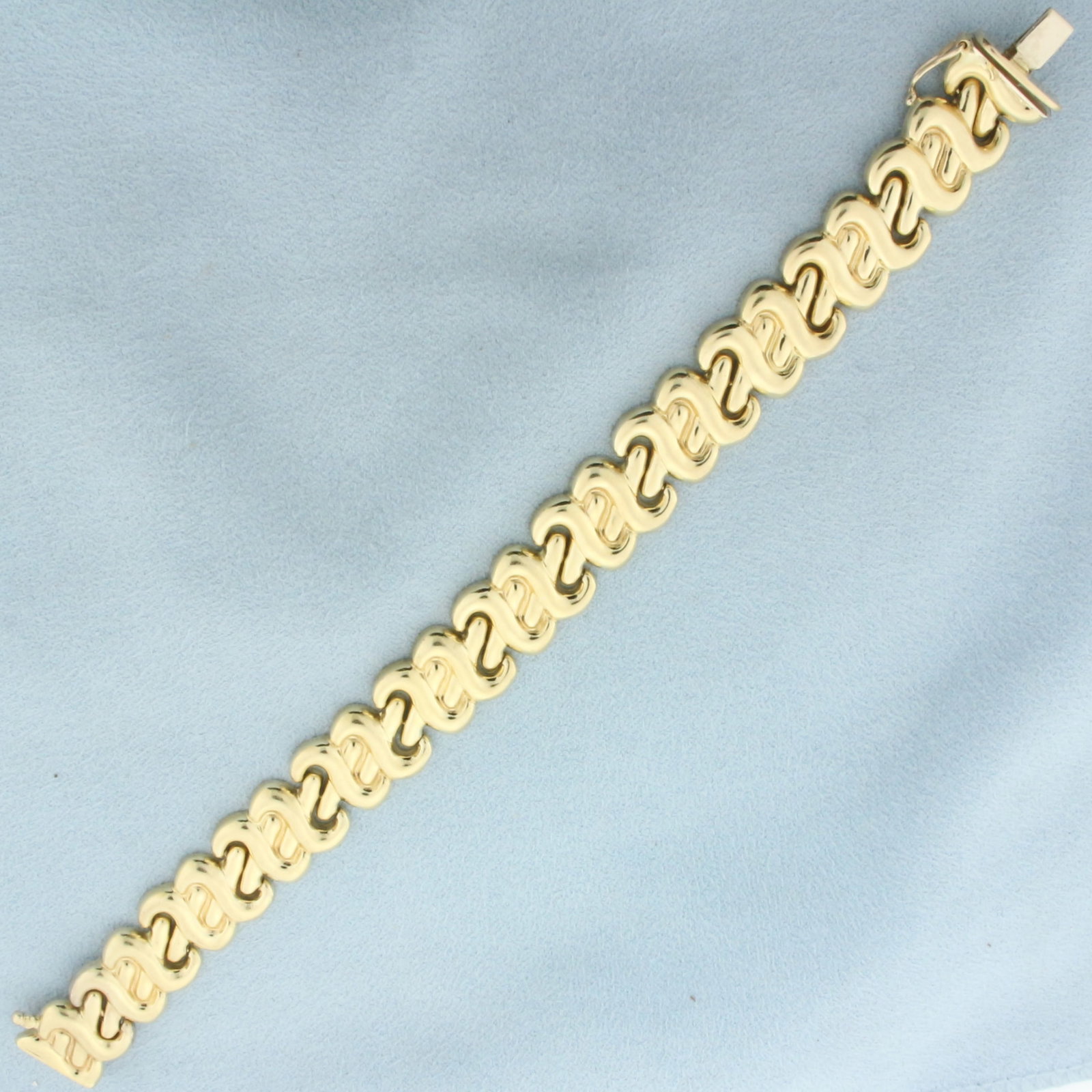 Italian Designer Link Bracelet in 14k Yellow Gold: In 14k yellow gold. Italian Made. 7 inches long and 12.8mm wide. Safety clasp. 18.4g.