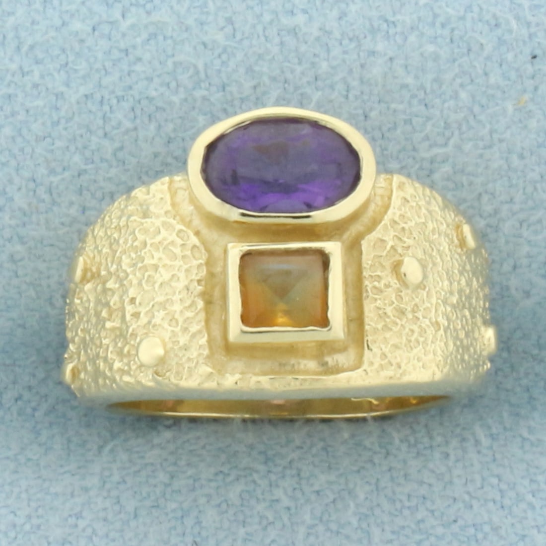 Amethyst and Citrine Pinky Ring in 14k Yellow Gold: In 14k yellow gold. Contains one high quality natural 6mm by 4mm Amethyst gemstone with vibrant color and excellent clarity. Also contains one high quality natural 3.5mm Citrine gemstone also with vib