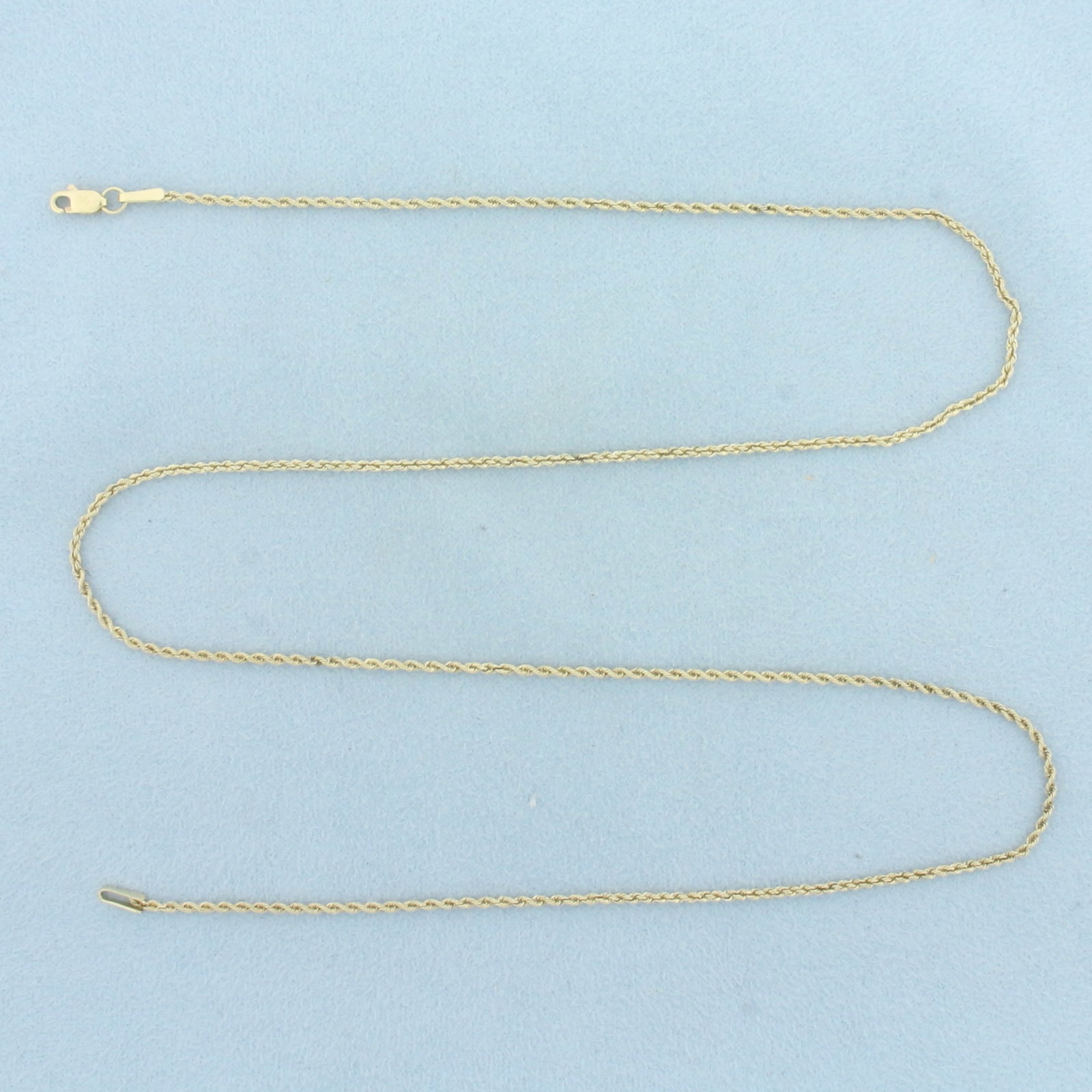 20 Inch Rope Link Chain Necklace in 14k Yellow Gold: In 14k Yellow Gold. 20 inches long. 1.2mm thick. Lobster clasp. 3.2g.