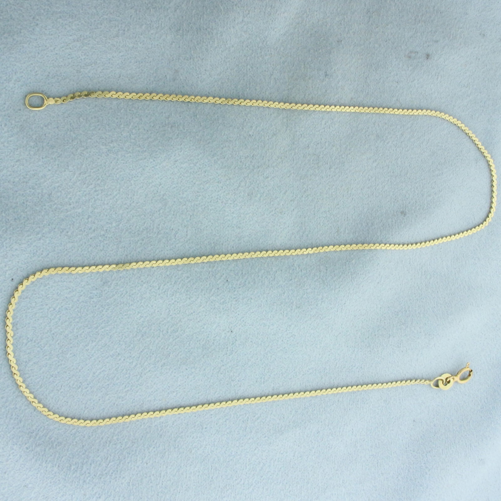 Italian S-Link Chain Choker Necklace in 14k Yellow Gold: In 14k Yellow Gold. 15 1/2 inches long. 1.3mm wide. Spring clasp. 3.0g.