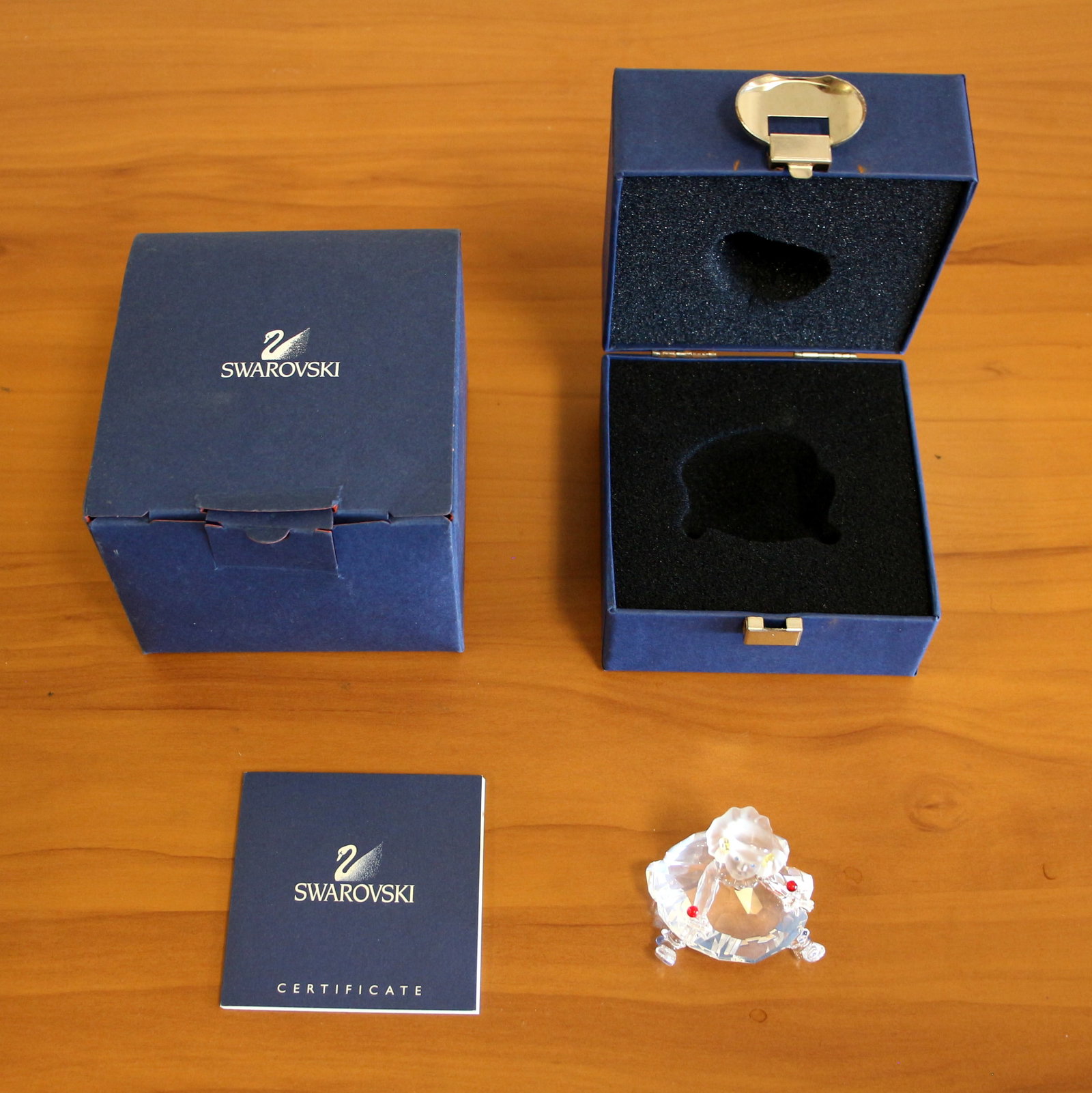 Swarovski Crystal Doll Cheerful Times #626247 With Box and COA: #626247. Sitting Girl - "Cheerful Times" collection. In mint condition, no defects. In original box with Swarovski certificate.