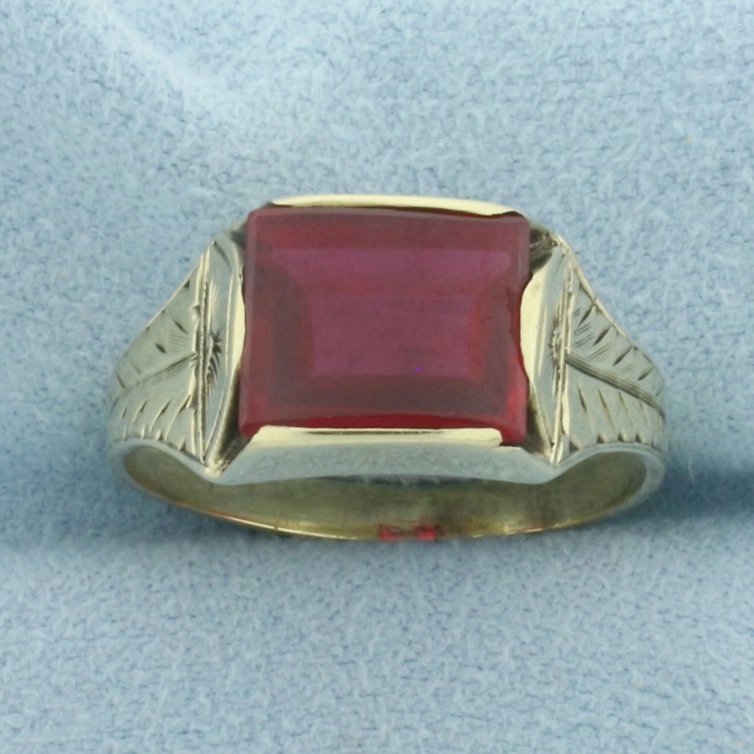 Antique Lab Ruby Solitaire Ring in 14k Yellow Gold: In 14k Yellow Gold. Contains one 9x9.5mm high quality Lab Ruby gemstone with deep color and excellent clarity. 9.3mm wide at center. Size 8.75. 4.5g.