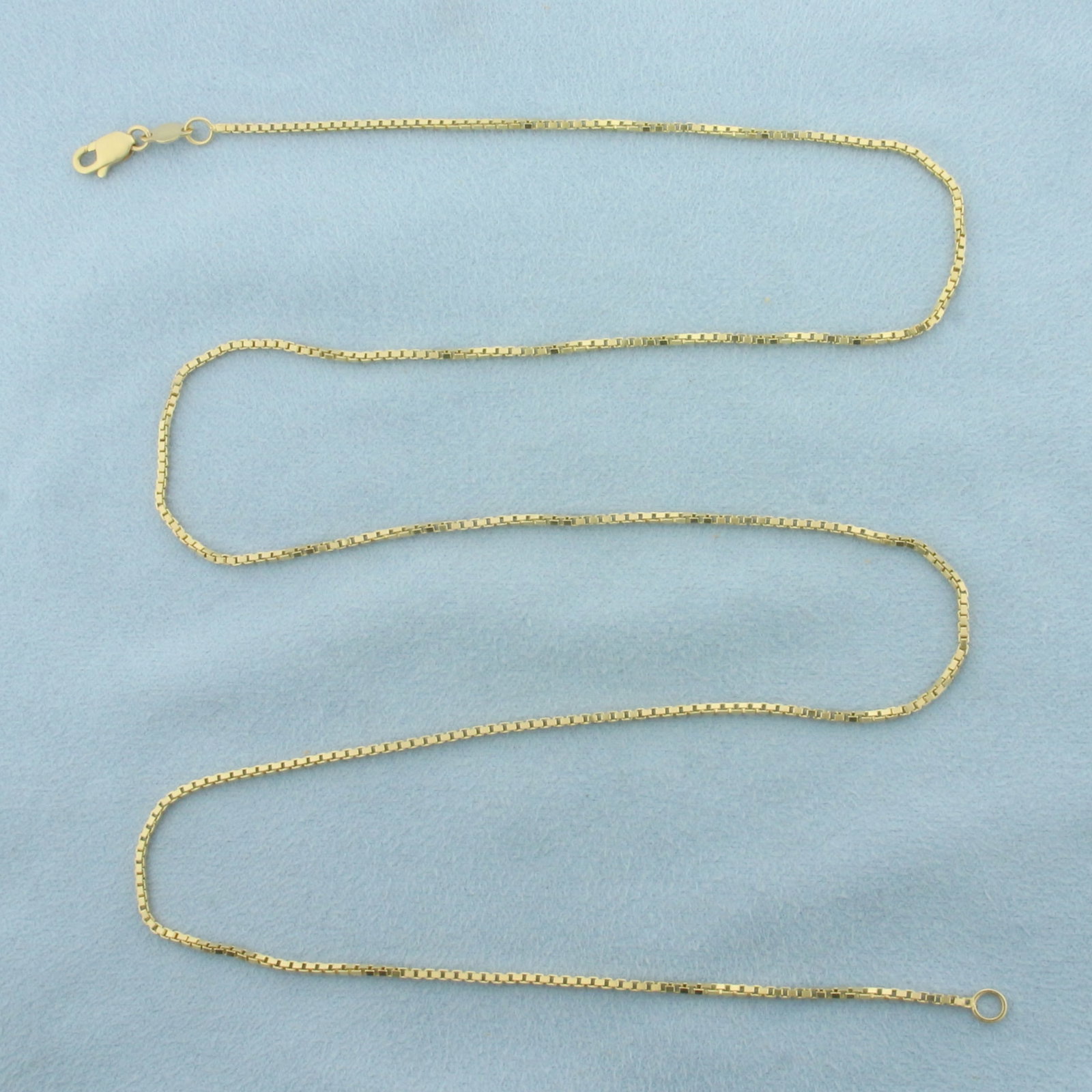 25 Inch Italian Box Link Chain Necklace in 14k Yellow Gold: In 14k yellow gold. Measures 25 inches long by 1.4mm wide. Lobster clasp. 7.0g