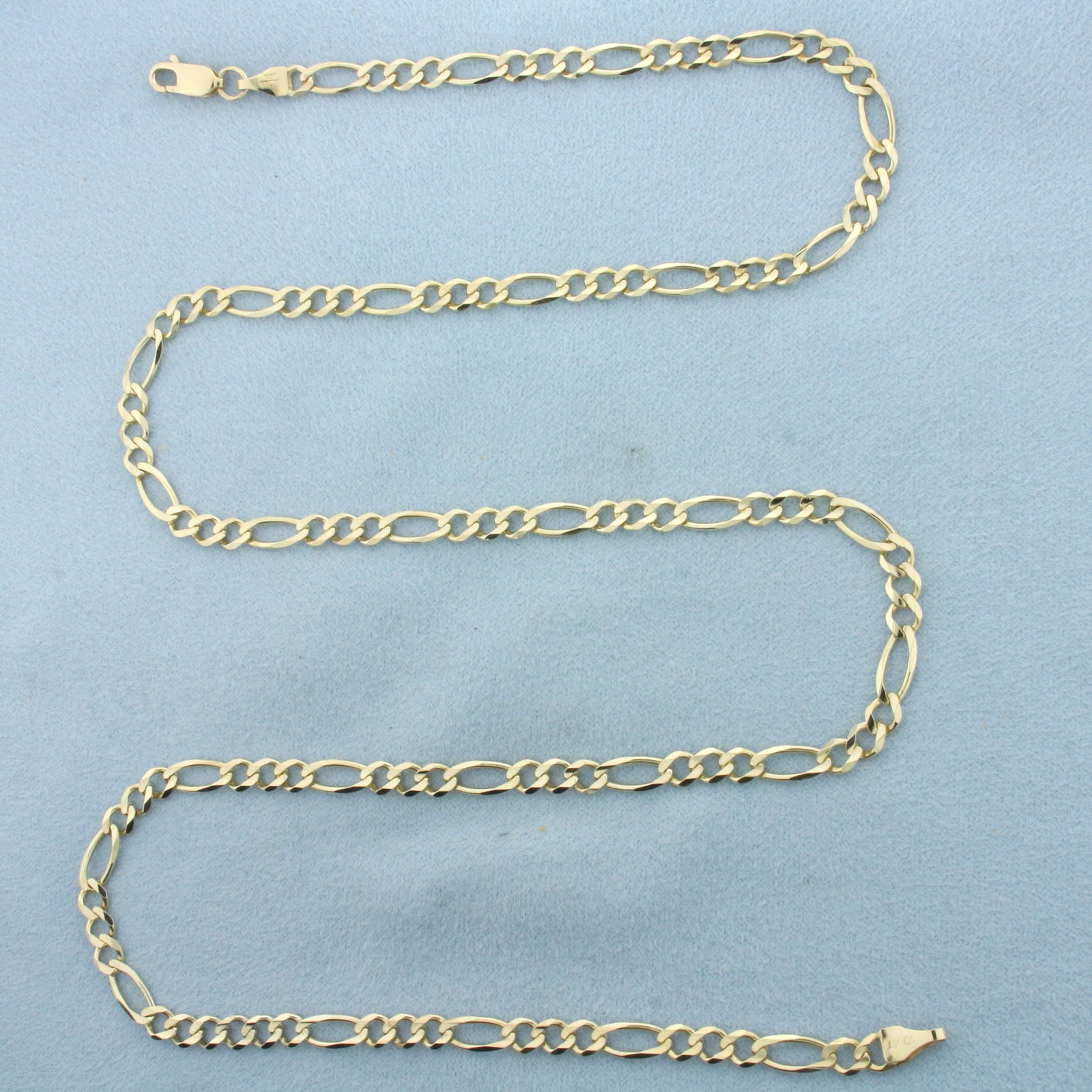24 Inch Figaro Link Chain Necklace in 10k Yellow Gold: In 10k Yellow Gold. 24 inches long. 4.4mm wide. Lobster clasp. 12.3g.