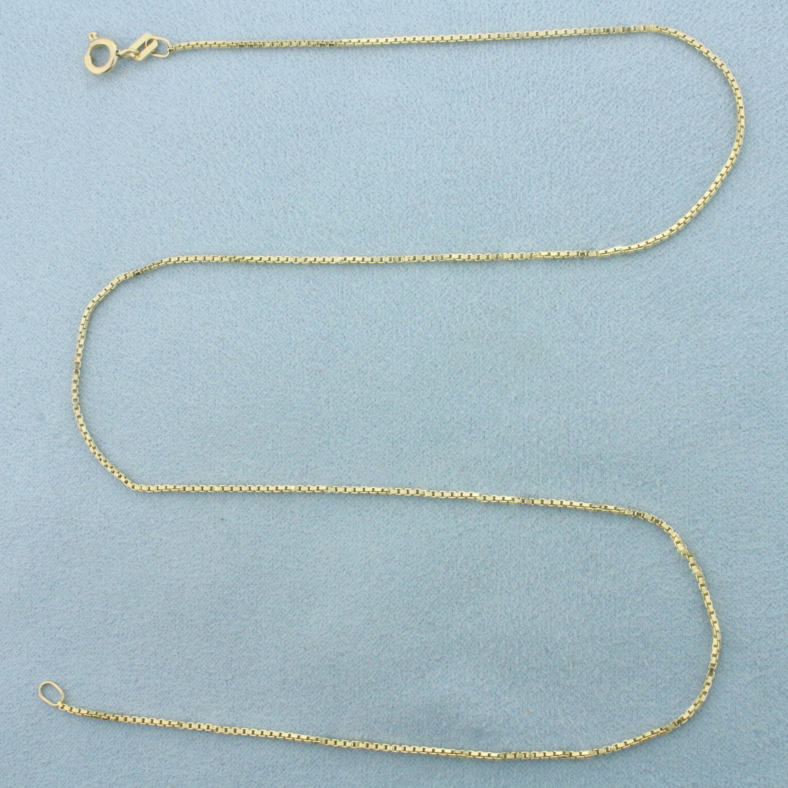 18 Inch Box Link Chain Necklace in 14k Yellow Gold: In 14k Yellow Gold. 18 inches long. 1.1mm wide. Spring clasp. 3.4g.