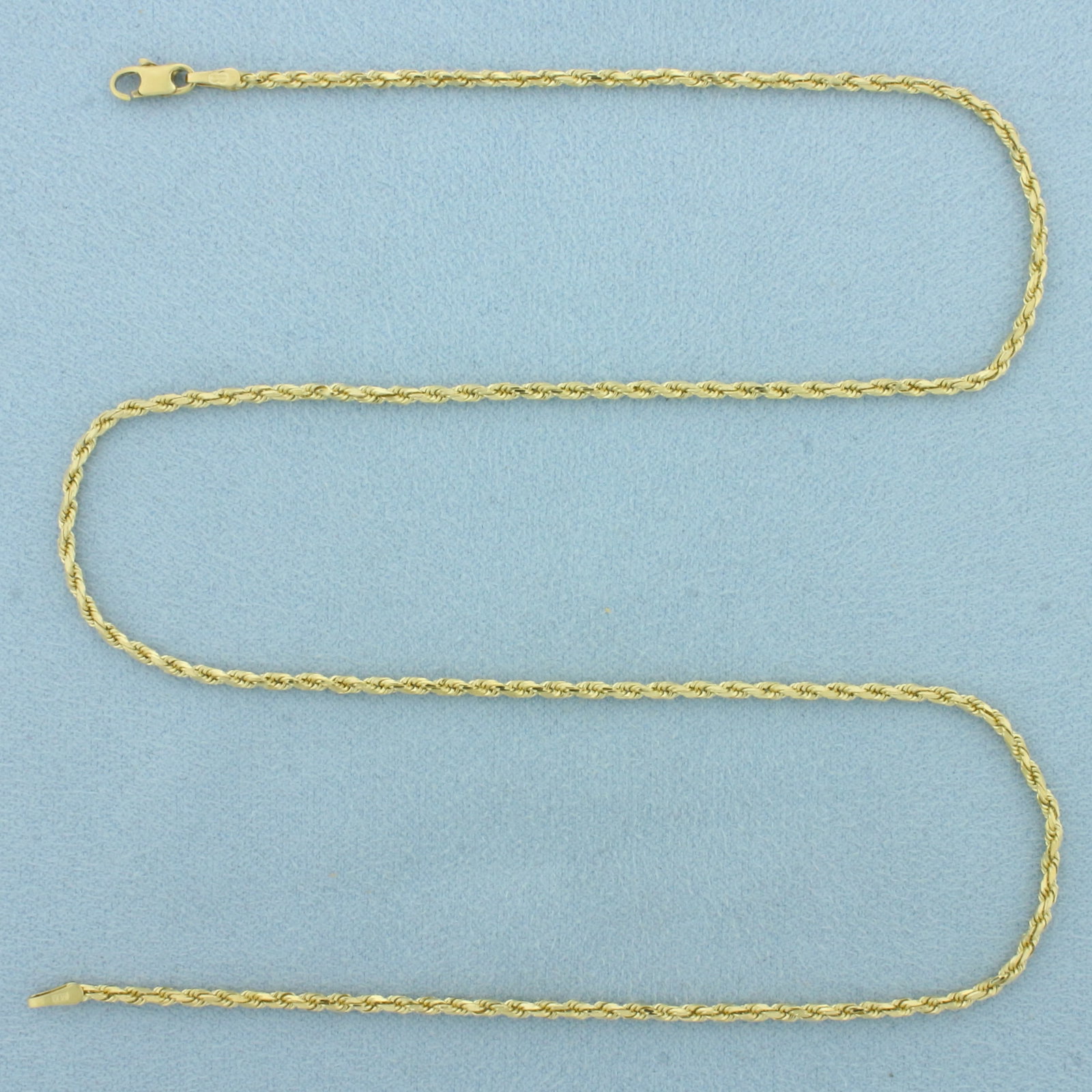 18 Inch Rope Link Chain Necklace in 14k Yellow Gold: In 14k Yellow Gold. 18 inches long. 1.8mm wide. Lobster clasp. 6.1g.