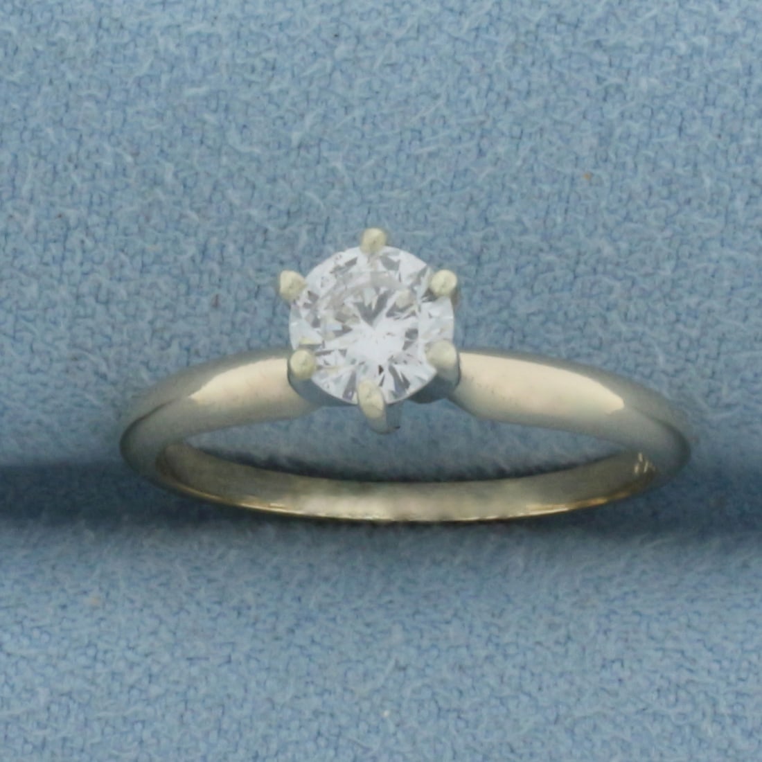 Diamond Solitaire Engagement Ring in 14k Yellow Gold: In 14k Yellow Gold. Contains one 5mm high quality 1/2ct diamonds, I1 clarity/H color, great cut for added brilliance. Size 4.5. 1.8g.