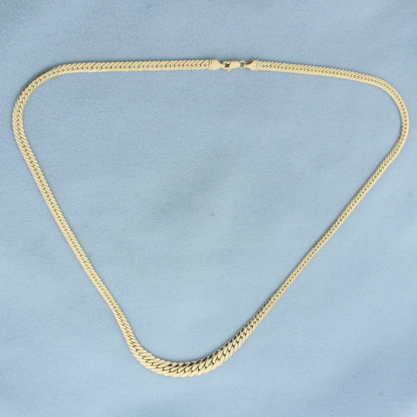 17 Inch Italian Graduated Herringbone Link Chain Necklace in 14k Yellow Gold: In 14k Yellow Gold. 16 7/8 inches long. 3.2 to 6.5mm wide. Italian made. Lobster clasp. 5.3g.