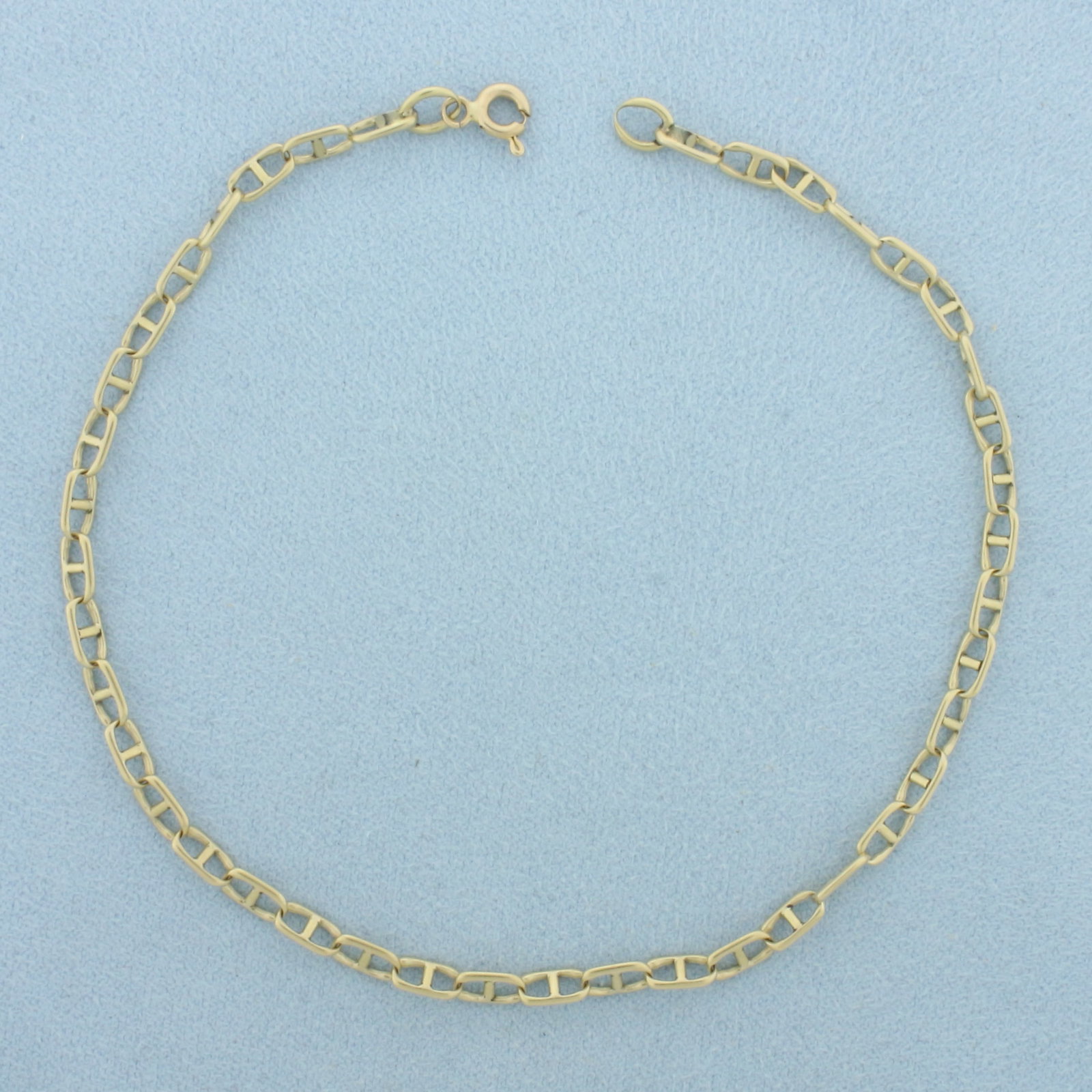 Anchor Mariner Anklet in 14k Yellow Gold: In 14k Yellow Gold. 9 1/2 inches long. 3.4mm wide. Spring clasp. 5.0g.