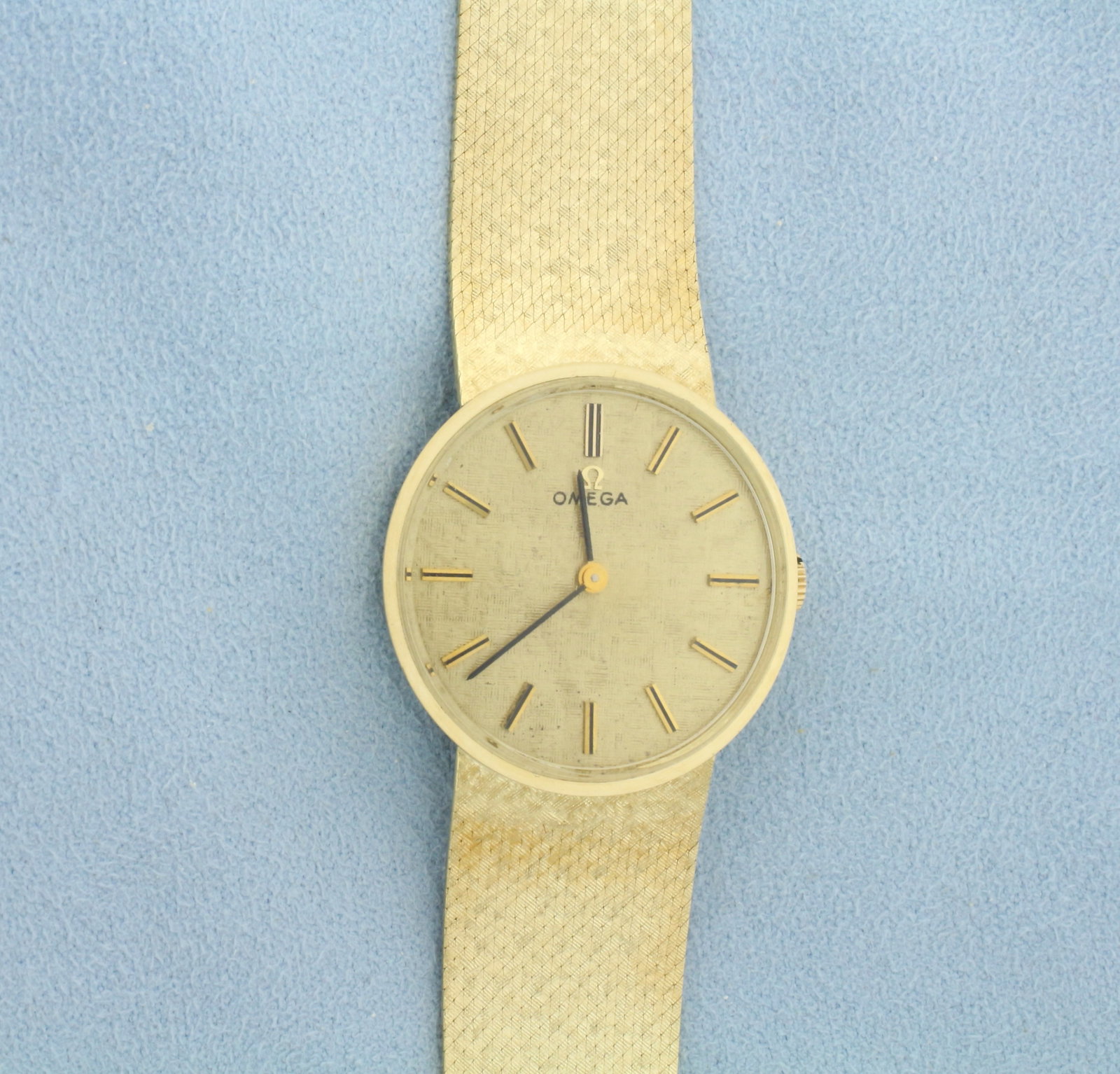 Vintage Omega Watch in Solid 14k Yellow Gold Case and Band: Band and Case In Solid 14k Yellow Gold. Windup movement runs great. In overall excellent condition, minor scratching on back of case. 7 1/4 inches long. Case 29mm diameter. Comes with original box.