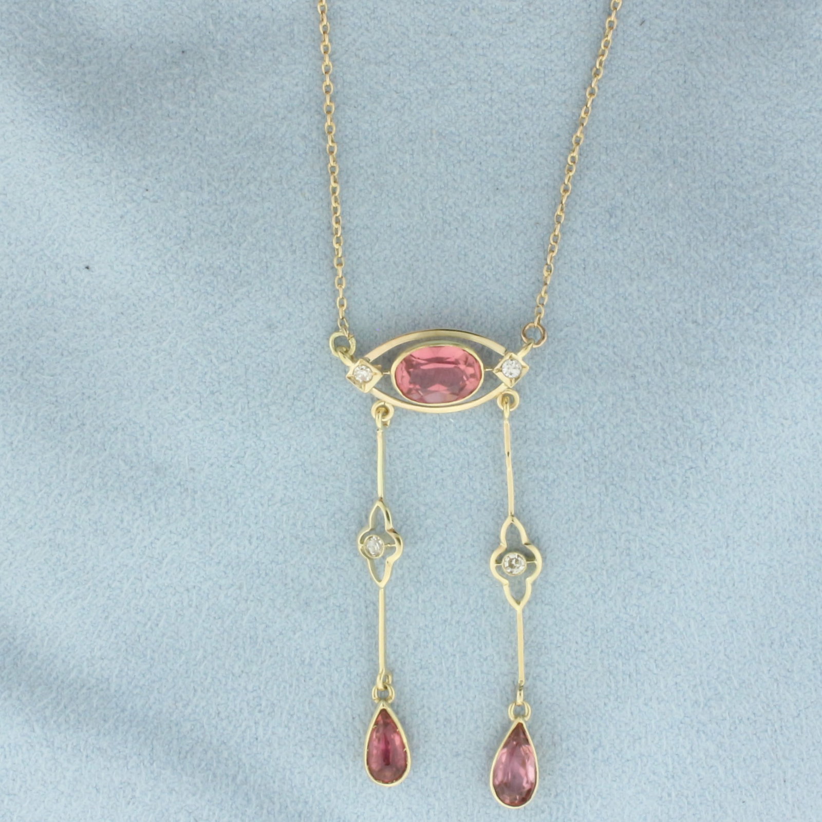 Vintage Morganite and Diamond Lavalier Dangle Necklace in 14k Yellow Gold: In 14k Yellow Gold. Contains one 8x6mm oval cut and two 7x4mm pear cut high quality natural Morganite gemstones, with vibrant salmon color and excellent clarity. Also contains four .03ct high quality 