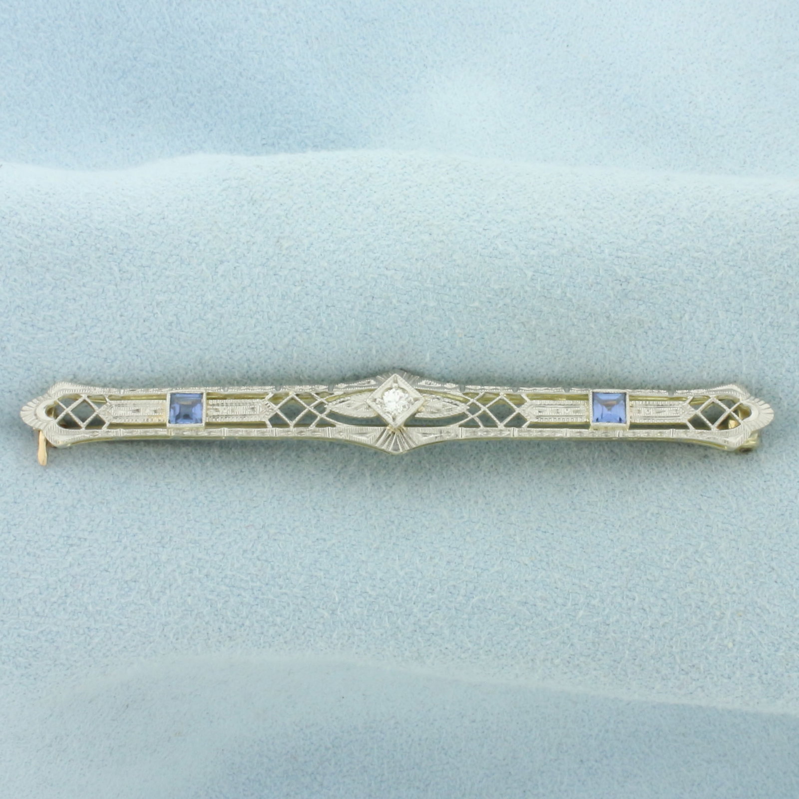 Antique Art Deco Old European Cut Diamond and Sapphire Pin Brooch in 14k White and Yellow Gold: In 14k White and Yellow Gold. Contains one 1/10ct high quality Old European cut diamond, VS clarity/H color. Also contains two 3mm high quality square step cut natural Sapphires, with vibrant color an