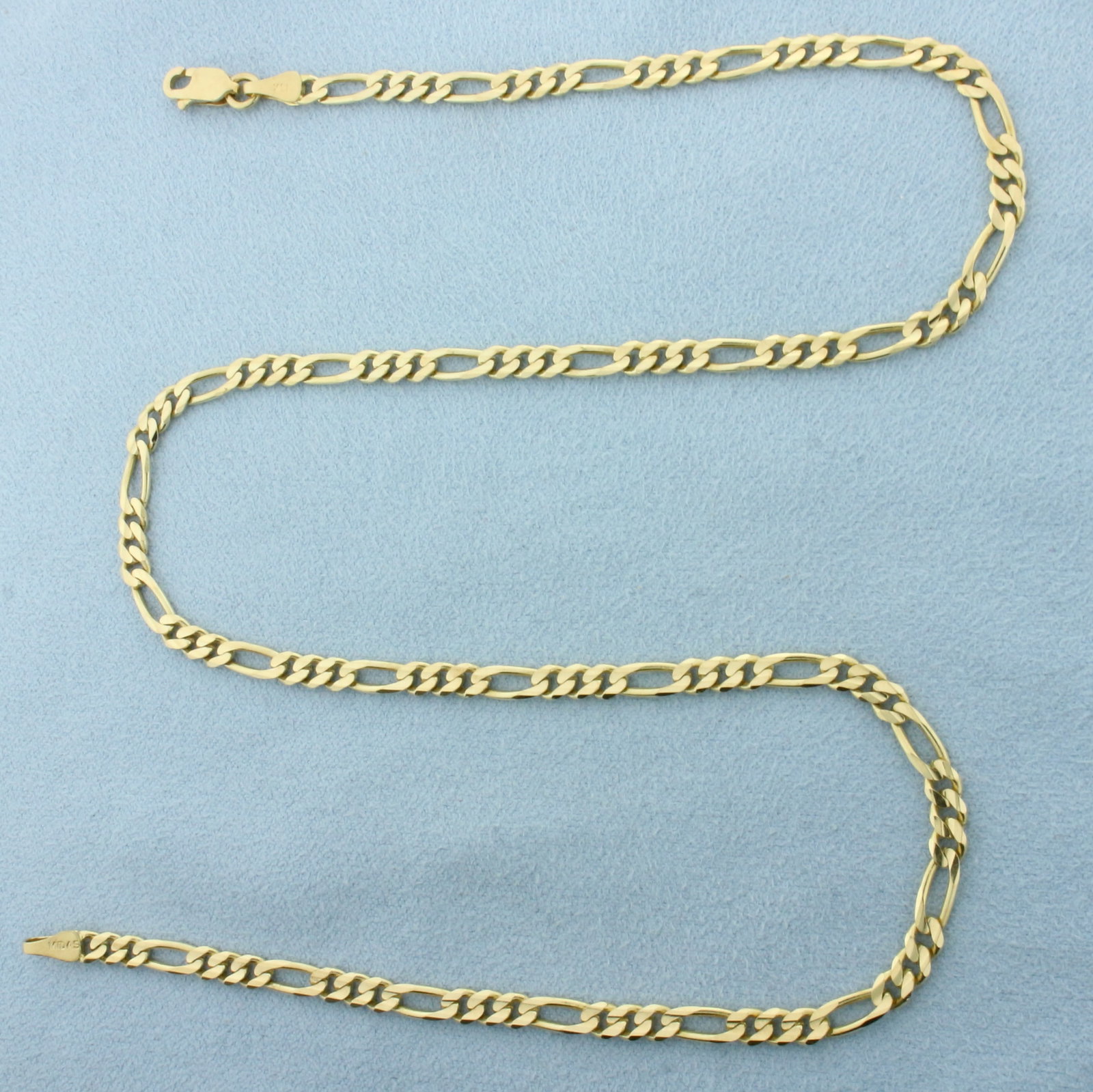 18 Inch Figaro Chain Link Necklace in 14k Yellow Gold: In 14k Yellow Gold. 18 inches long. 3.5mm wide. Lobster clasp. 11.7g.