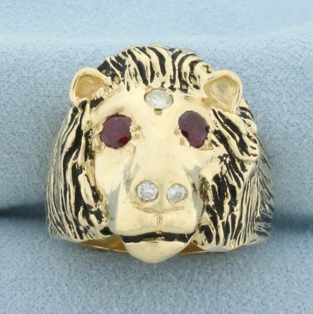 Mens Lion Ring with Ruby and Diamond in 14k Yellow Gold: In 14k yellow gold. 24mm wide at top of ring. Contains two high quality 4mm Ruby gemstones for eyes. Also contains three high quality diamonds, 1/4ct TW, SI clarity/H color. Black enamel detailing. Si